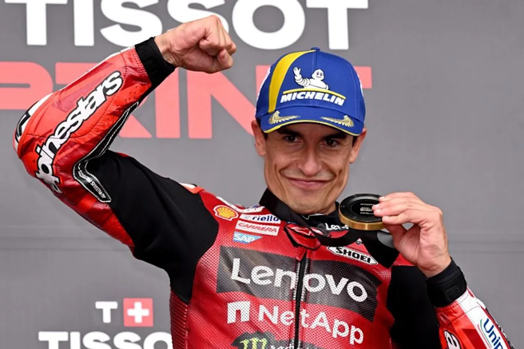 Ducati Lenovo Team's Spanish rider Marc Marquez celebrates after winning the MotoGP sprint race at the Australian MotoGP Grand Prix on Phillip Island on October 24, 2026.   William WEST / AFP