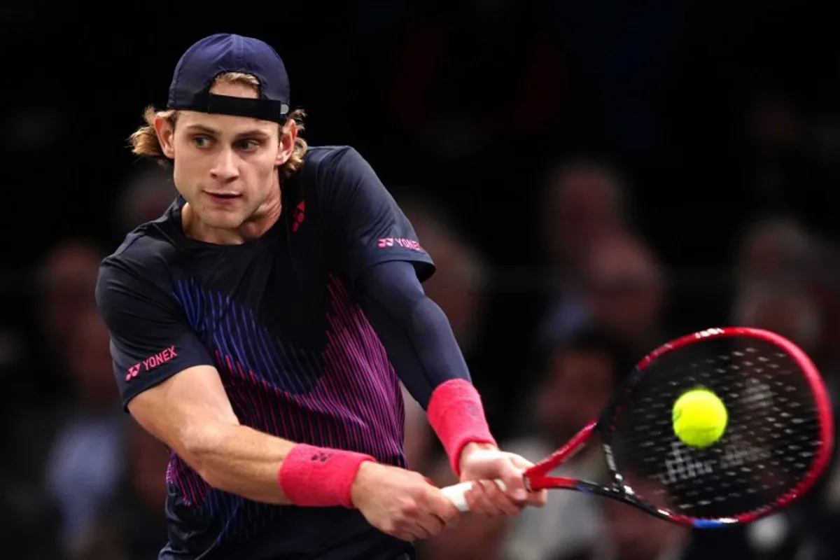 Belgium's Zizou Bergs plays a backhand return to France's Richard Gasquet during their men's singles match on day two of the Paris ATP Masters 1000 tennis tournament at the Accor Arena - Palais Omnisports de Paris-Bercy - in Paris on October 29, 2024.  Dimitar DILKOFF / AFP