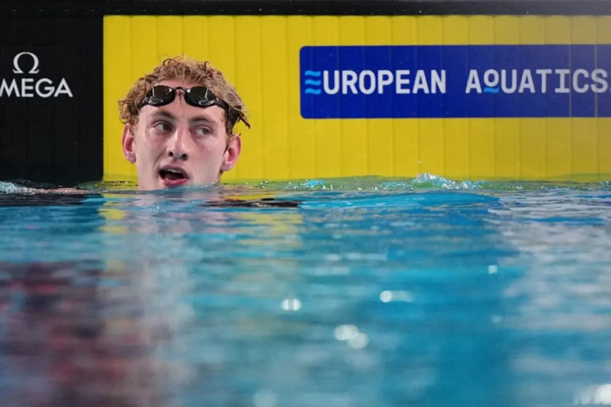 Neutral Athlete B's Ilia Borodin reacts after winning the final of the men's 400m individual medley swimming event during the LEN European Aquatics Championships at the Olympic Aquatic Centre in Saint-Denis, northern suburbs of Paris, on August 10, 2026. Dimitar DILKOFF / AFP