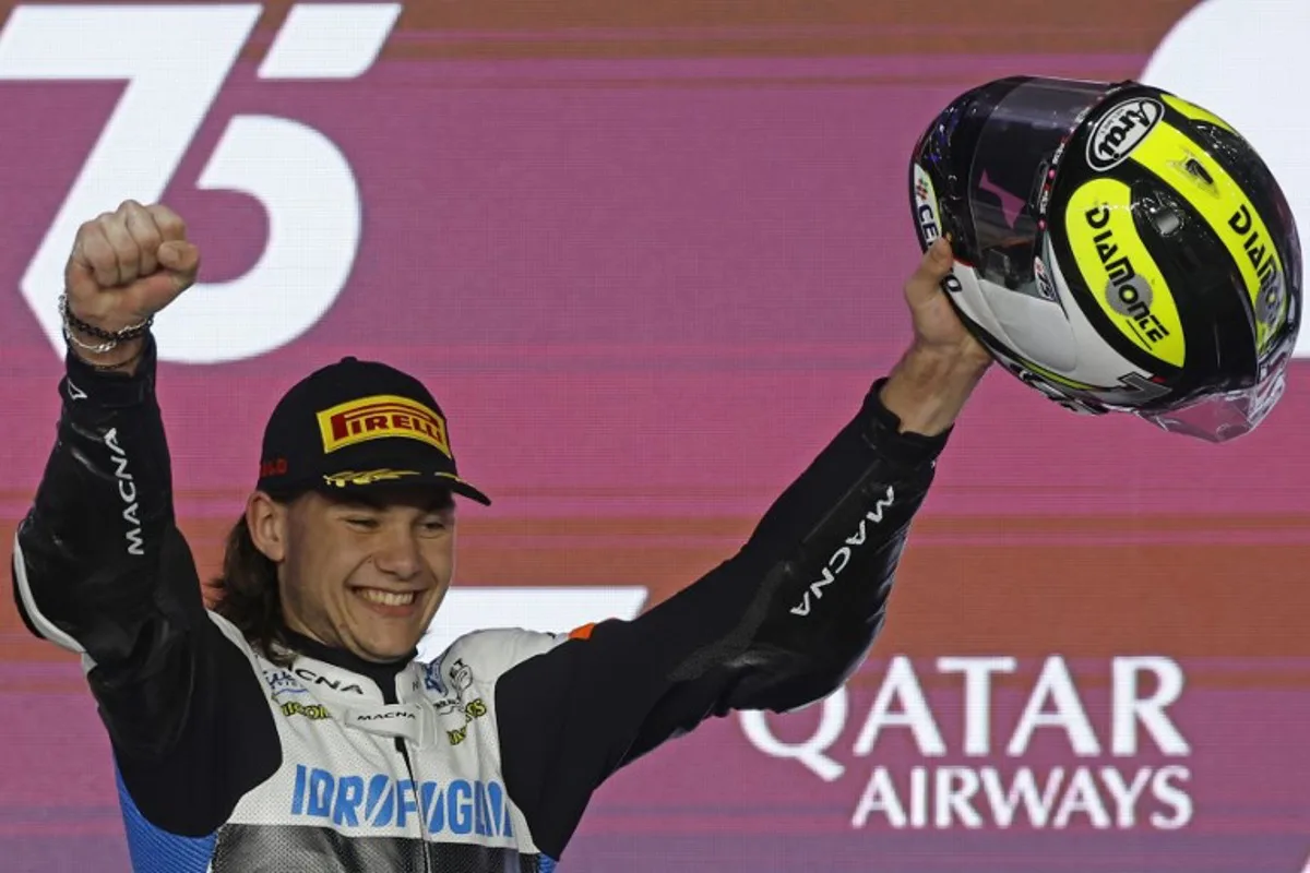 Second placed RW Racing GP Belgian rider Barry Baltus celebrates during the podium ceremony of the Moto2 race of the Qatar MotoGP Grand Prix at the Lusail International Circuit in Lusail, north of Doha on March 10, 2024.  KARIM JAAFAR / AFP