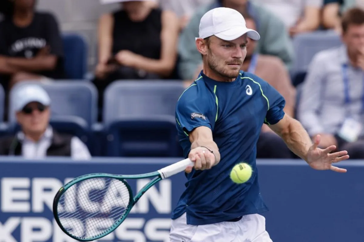 Belgium's David Goffin hits a return to Czech Republic's Tomas Machac during their men's singles third round match on day six of the US Open tennis tournament at the USTA Billie Jean King National Tennis Center in New York City, on August 31, 2024.  Kena Betancur / AFP