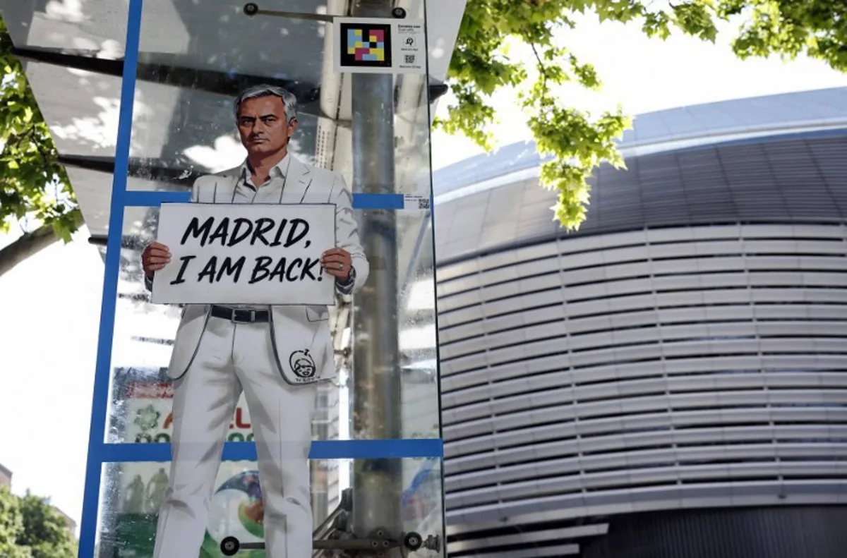 A mural by Italian urban artist Salvatore Benintende aka "TV BOY" depicting Portuguese coach Jose Mourinho is seen in front of the Santiago Bernabeu stadium in Madrid on May 21, 2026.   Benfica coach Jose Mourinho confirmed on May 17, 2026 his agent Jorge Mendes has been in contact with Spanish giants Real Madrid. The veteran Portuguese coach, 63, has been strongly linked with a sensational return to the Santiago Bernabeu 13 years after he left Los Blancos. Mourinho said he personally has not had any contact with Madrid president Florentino Perez, or anyone else at the club, and that his future will be decided in the coming week.  OSCAR DEL POZO / AFP