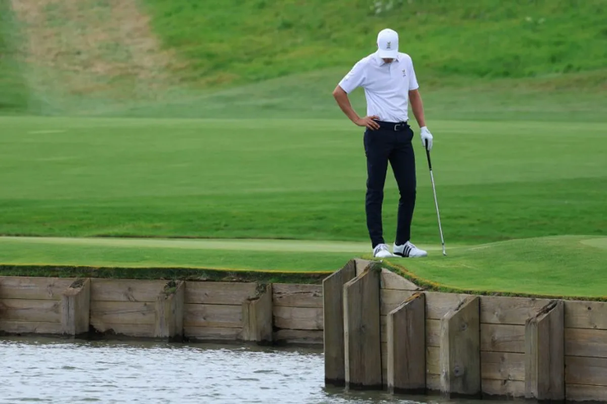 Belgium's Adrien Dumont de Chassart looks on after his ball fell in the water in round 3 of the men's golf individual stroke play of the Paris 2024 Olympic Games at Le Golf National in Guyancourt, south-west of Paris on August 3, 2024.   Emmanuel DUNAND / AFP