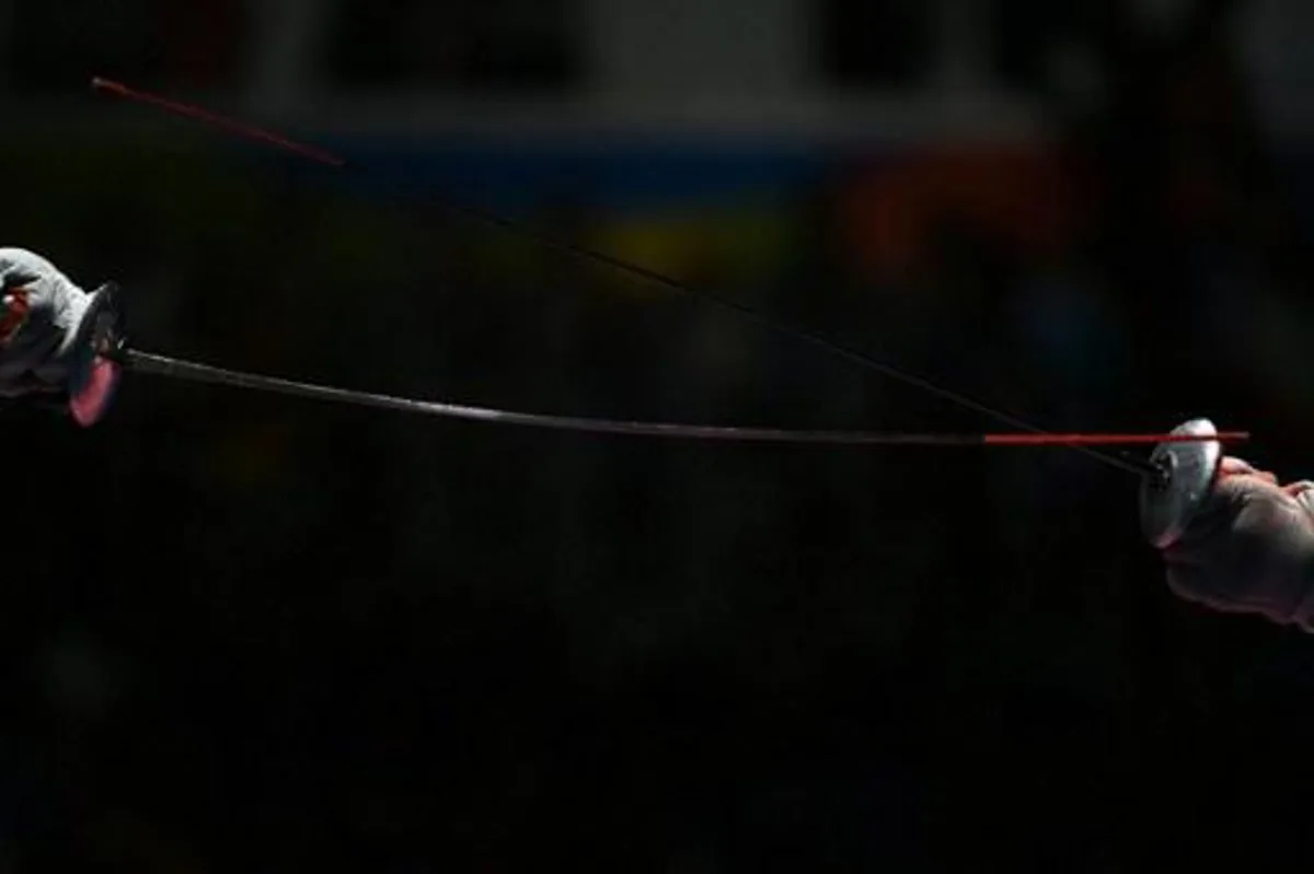 Russia's Timur Safin competes against China's Chen Haiwei during their men¿s individual foil quarter-final bout as part of the fencing event of the Rio 2016 Olympic Games, on August 7, 2016, at the Carioca Arena 3, in Rio de Janeiro.
Kirill KUDRYAVTSEV / AFP
