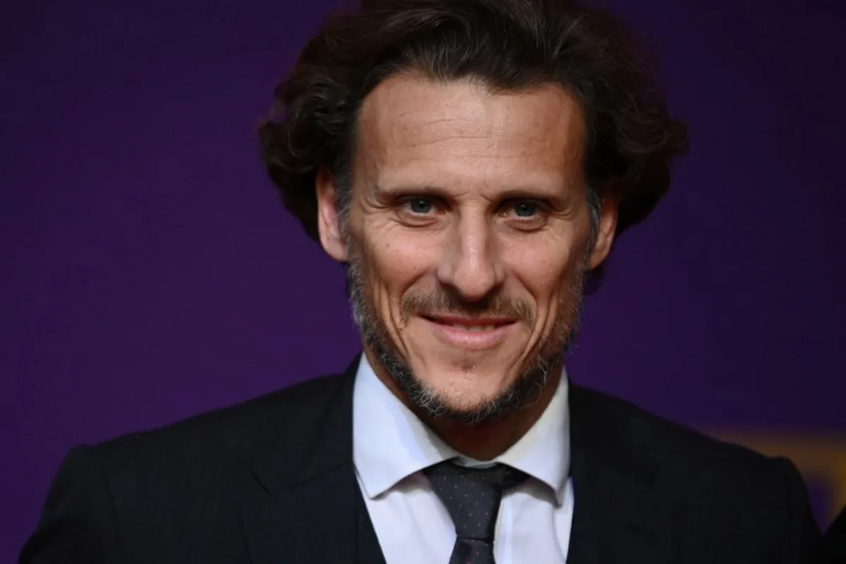 Former Uruguayan footballer Diego Forlan arrives for the draw for the 2022 World Cup in Qatar at the Doha Exhibition and Convention Center on April 1, 2022.  FRANCK FIFE / AFP