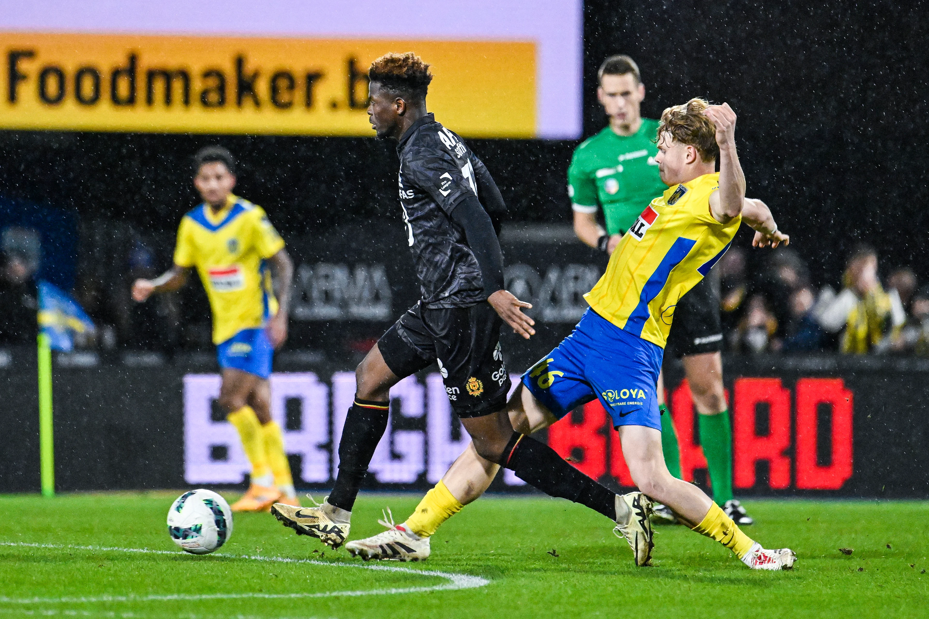 Mechelen's Aziz Ouatarra and Westerlo's Arthur Piedfort pictured in action during a soccer match between KVC Westerlo and KV Mechelen, Friday 20 December 2024 in Westerlo, on day 19 of the 2024-2025 season of the 'Jupiler Pro League' first division of the Belgian championship. BELGA PHOTO TOM GOYVAERTS