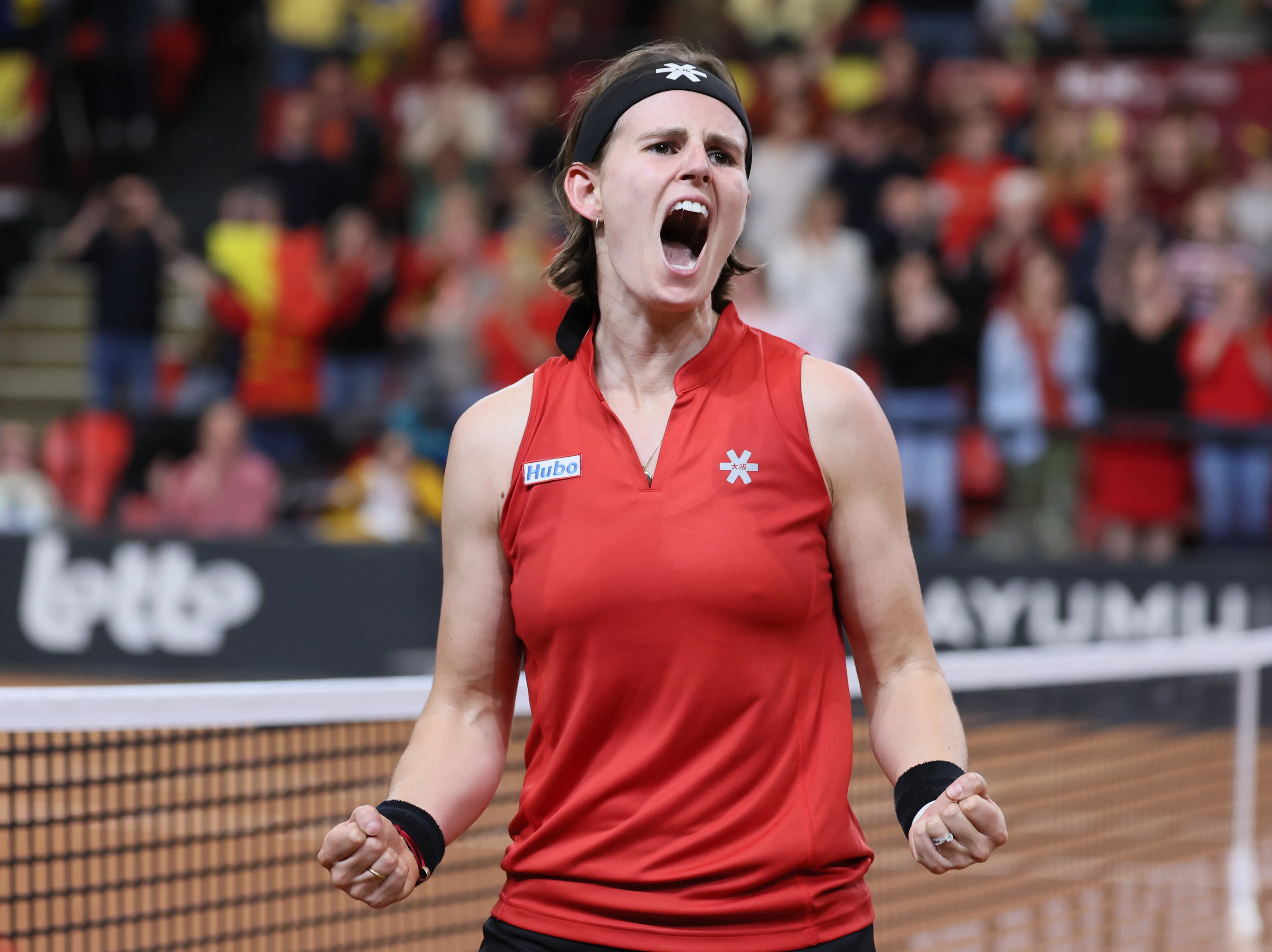 Belgian Greet Minnen and reacts after winning the fourth game between Belgian Minnen and US' Jovic on the second day of the qualifiers of the Billie Jean King Cup tennis between Belgium and the USA, in Oostende, Belgium, on . The meeting takes place on 10 and 11th April. PHOTO BENOIT DOPPAGNE