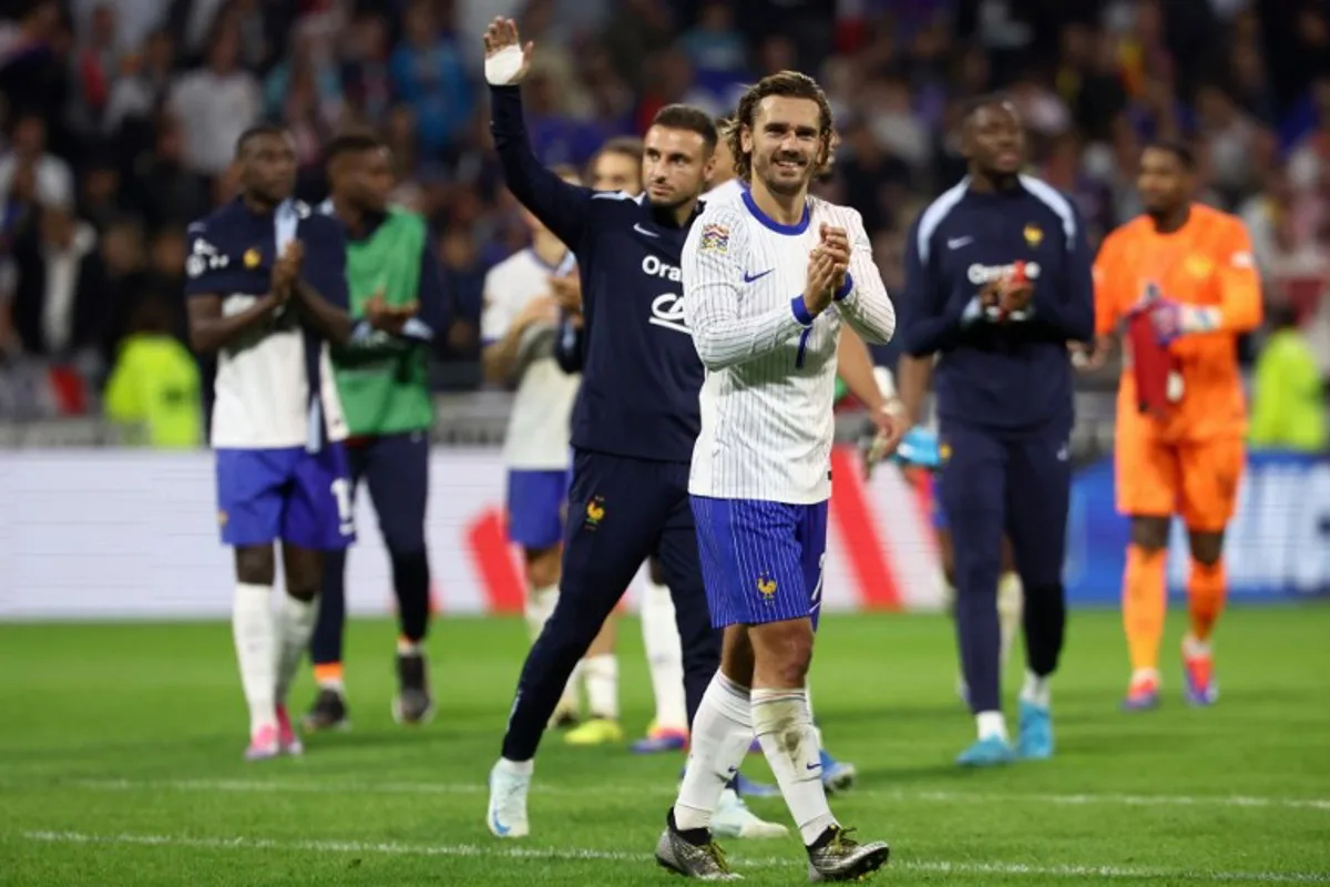 France's midfielder #07 Antoine Griezmann (C) acknowledges the supporters at the end of the UEFA Nations League, League A - Group 2 first leg football match between France and Belgium at the Parc Olympique Lyonnais in Lyon on September 9, 2024.  Franck FIFE / AFP