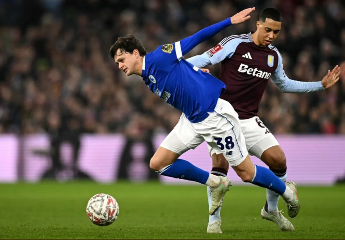 Aston Villa's Belgian midfielder #08 Youri Tielemans fouls Cardiff City's English defender #38 Perry Ng during the English FA Cup fifth round football match between Aston Villa and Cardiff City at Villa Park in Birmingham, central England on February 28, 2025.  Oli SCARFF / AFP