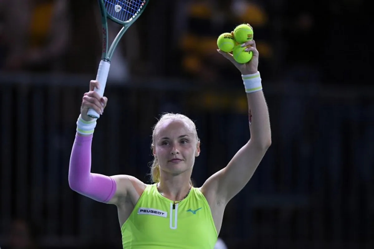 Slovakia's Rebecca Sramkova celebrates her victory over US' Danielle Collins during their singles tennis match between Slovakia and USA at the Billie Jean King Cup Finals at the Palacio de Deportes Jose Maria Martin Carpena in Malaga, Spain, on November 14, 2024.   JORGE GUERRERO / AFP