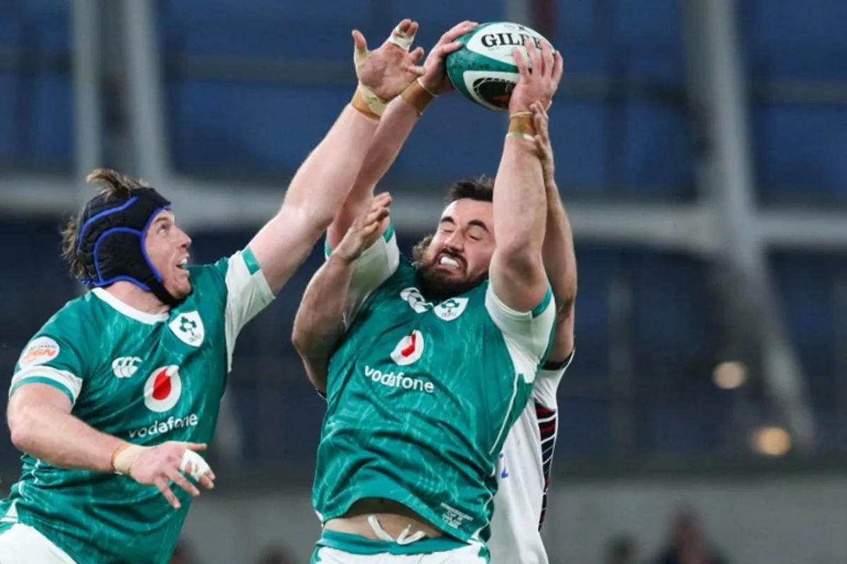 Ireland's hooker Ronan Kelleher (R) catches the ball next to Ireland's flanker Ryan Baird during the Six Nations international rugby union match between Ireland and England at the Aviva Stadium in Dublin, on February 1, 2025.  Paul Faith / AFP