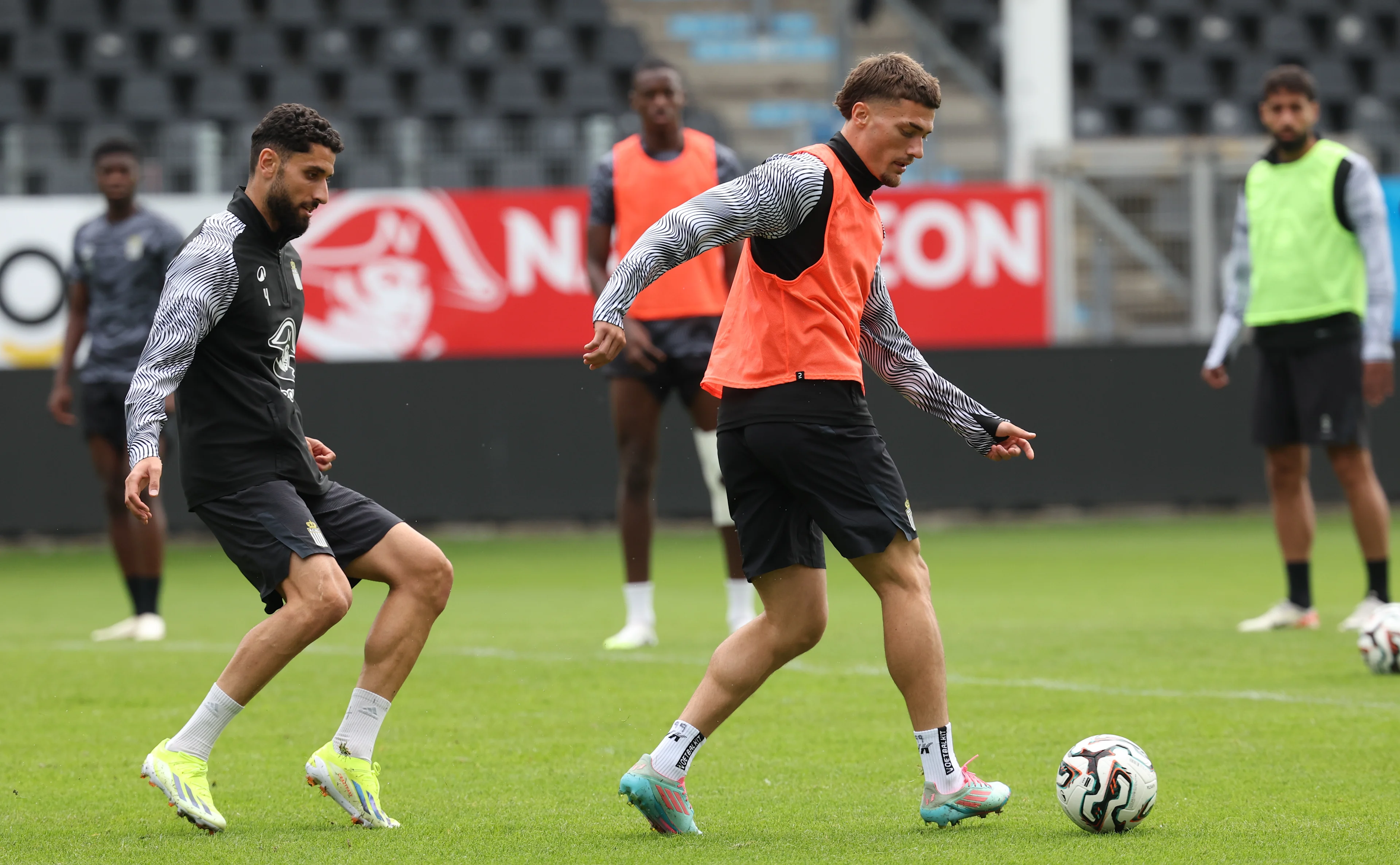Charleroi's Aiham Ousou and Charleroi's Anthony Descotte fight for the ball during a training session of Belgian soccer team Sporting Charleroi, on Wednesday 30 July 2025 in Charleroi. The team is preparing for tomorrow's game against Swedish Hammarby Fotboll, the return leg of the 2nd qualifying round for the UEFA Conference League competition. The first leg resulted in a 0-0 draw. BELGA PHOTO VIRGINIE LEFOUR