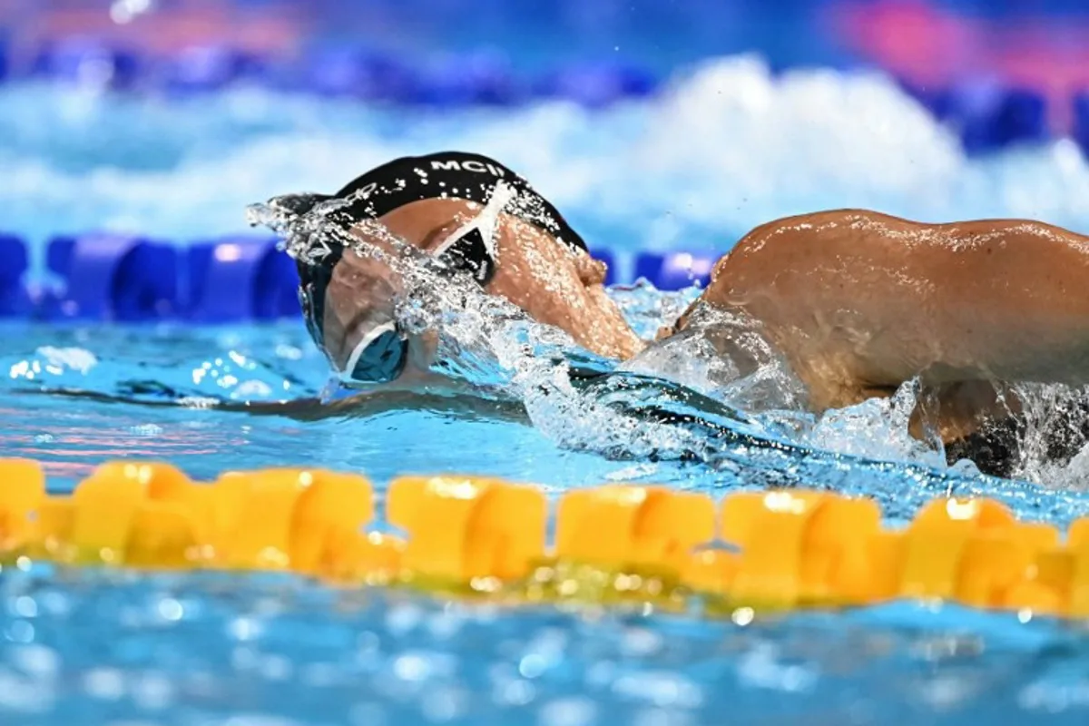 Canada's swimmer Summer Mcintosh competes in the final of the women's 400m freestyle swimming event during the 2025 World Aquatics Championships in Singapore on July 27, 2025. MANAN VATSYAYANA / AFP