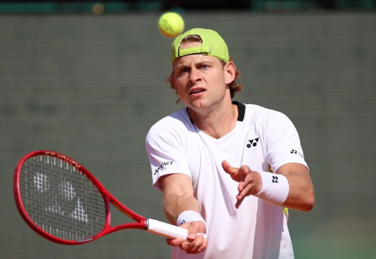 Belgium's Zizou Bergs plays a forehand return to Germany's Alexander Zverev during their Monte Carlo ATP Masters Series Tournament round of 16 tennis match on Court Rainier III at the Monte-Carlo Country Club in Roquebrune-Cap-Martin, south-eastern France on April 9, 2026.  Valery HACHE / AFP