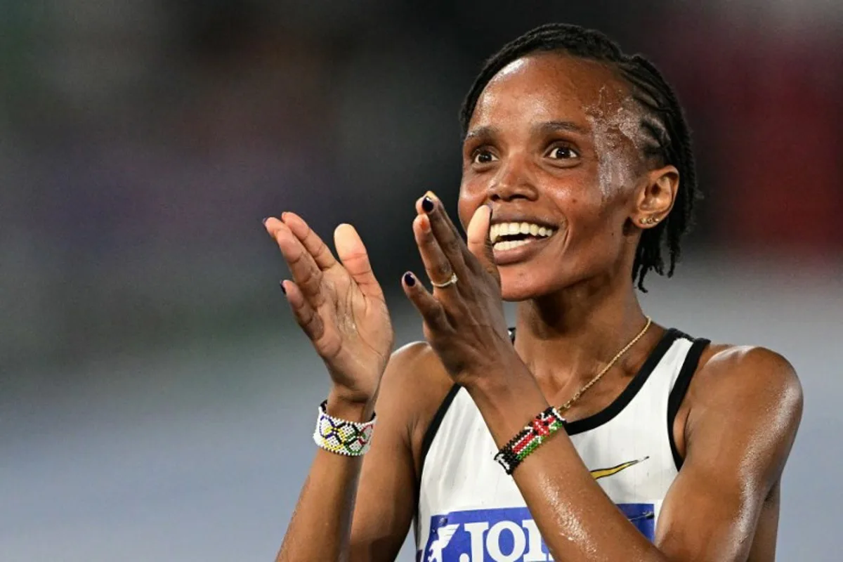 Kenya's Beatrice Chebet celebrates after winning the women's 5000m event of the Diamond League athletics meeting at the Olympic stadium in Rome on June 6, 2025. Tiziana FABI / AFP