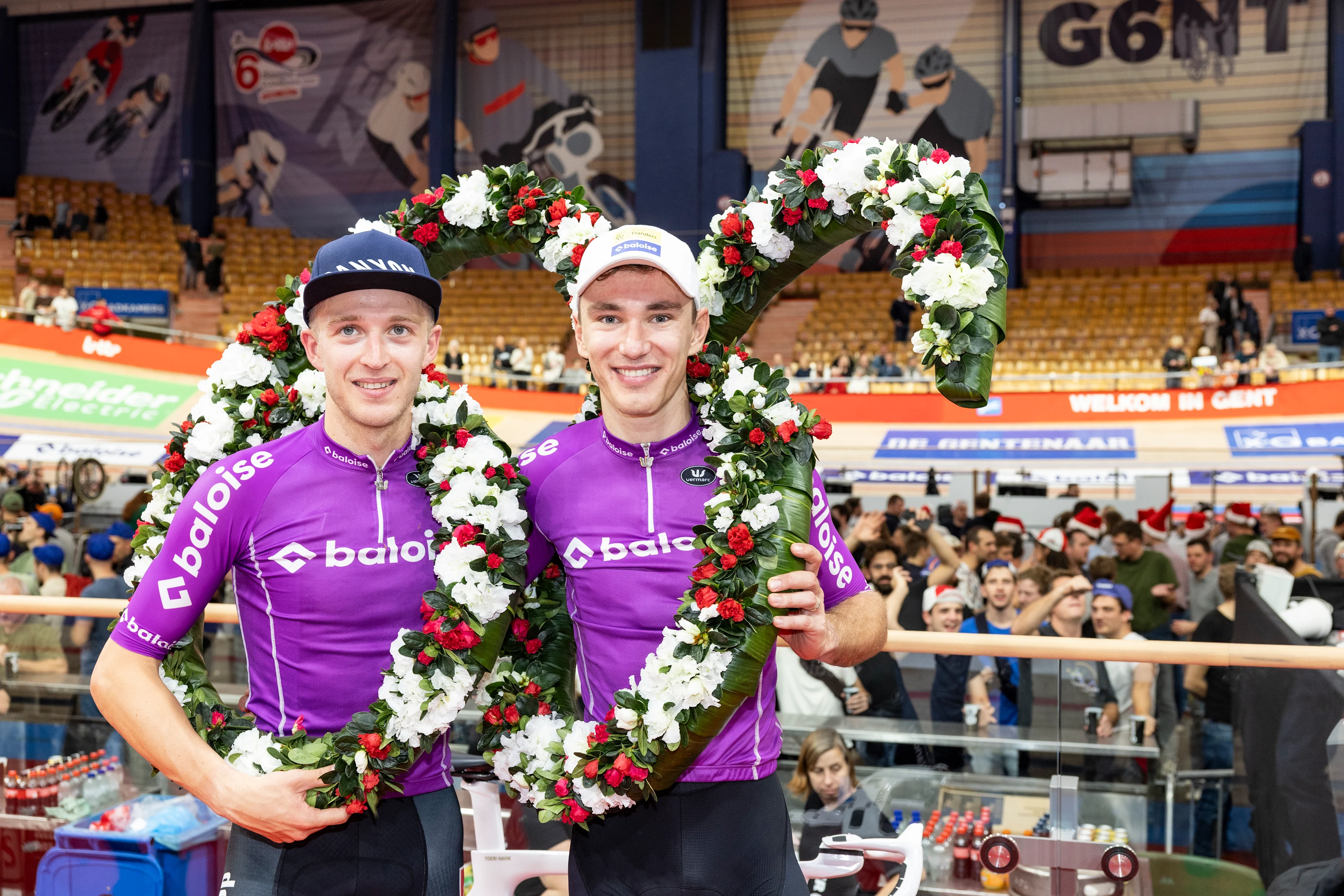 Belgian Robbe Ghys and Belgian Lindsay De Vylder celebrate after winning the final day of the Zesdaagse Vlaanderen-Gent six-day indoor track cycling event at the indoor cycling arena 't Kuipke, Sunday 19 November 2023, in Gent. BELGA PHOTO DAVID PINTENS