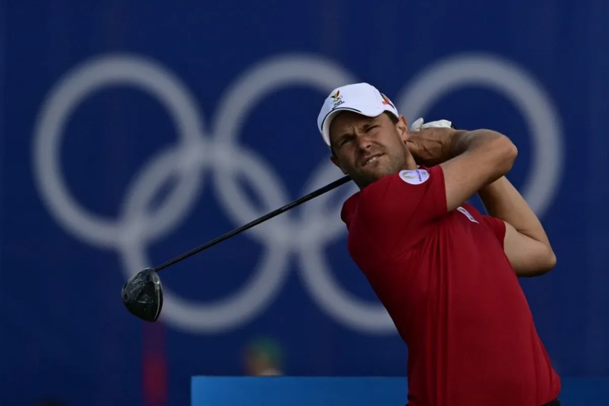 Belgium's Thomas Detry tees off in round 2 of the men's golf individual stroke play of the Paris 2024 Olympic Games at Le Golf National in Guyancourt, south-west of Paris on August 2, 2024. John MACDOUGALL / AFP