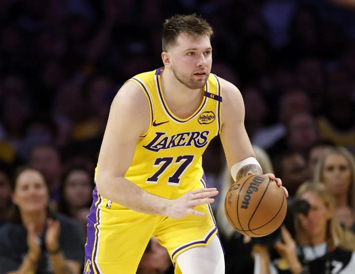 Luka Doncic #77 of the Los Angeles Lakers dribbles during a 103-96 loss to the Minnesota Timberwolves in Game Five of the Western Conference First Round NBA Playoffs at Crypto.com Arena on April 30, 2025 in Los Angeles, California. NOTE TO USER: User expressly acknowledges and agrees that, by downloading and or using this photograph, User is consenting to the terms and conditions of the Getty Images License Agreement. Doncic has signed a new long-term contract extension with the Los Angeles Lakers, the club announced on August 2, 2025, in a deal reportedly worth $165 million over three years. The Slovenian star, who joined the Lakers in a jaw-dropping trade earlier this year, will remain with the Lakers for the next three years through to 2028. Harry How / GETTY IMAGES NORTH AMERICA / AFP