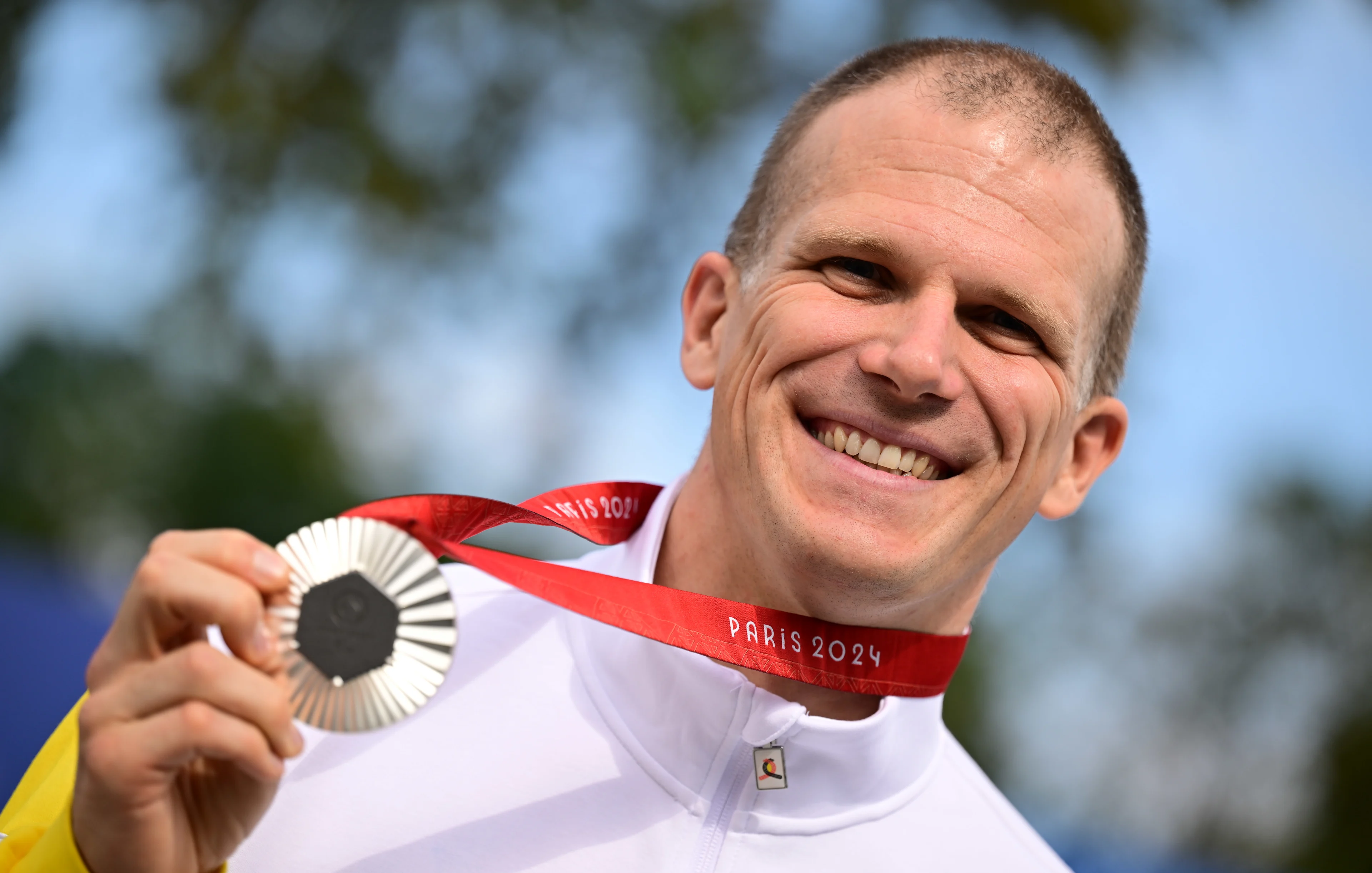 Belgian Paralympian athlete Ewoud Vromant celebrates on the podium with the silver medal at the time trial of the men MC2 category, in the para cycling, on day 8 of the 2024 Summer Paralympic Games in Paris, France on Wednesday 04 September 2024. The 17th Paralympics are taking place from 28 August to 8 September 2024 in Paris. BELGA PHOTO LAURIE DIEFFEMBACQ