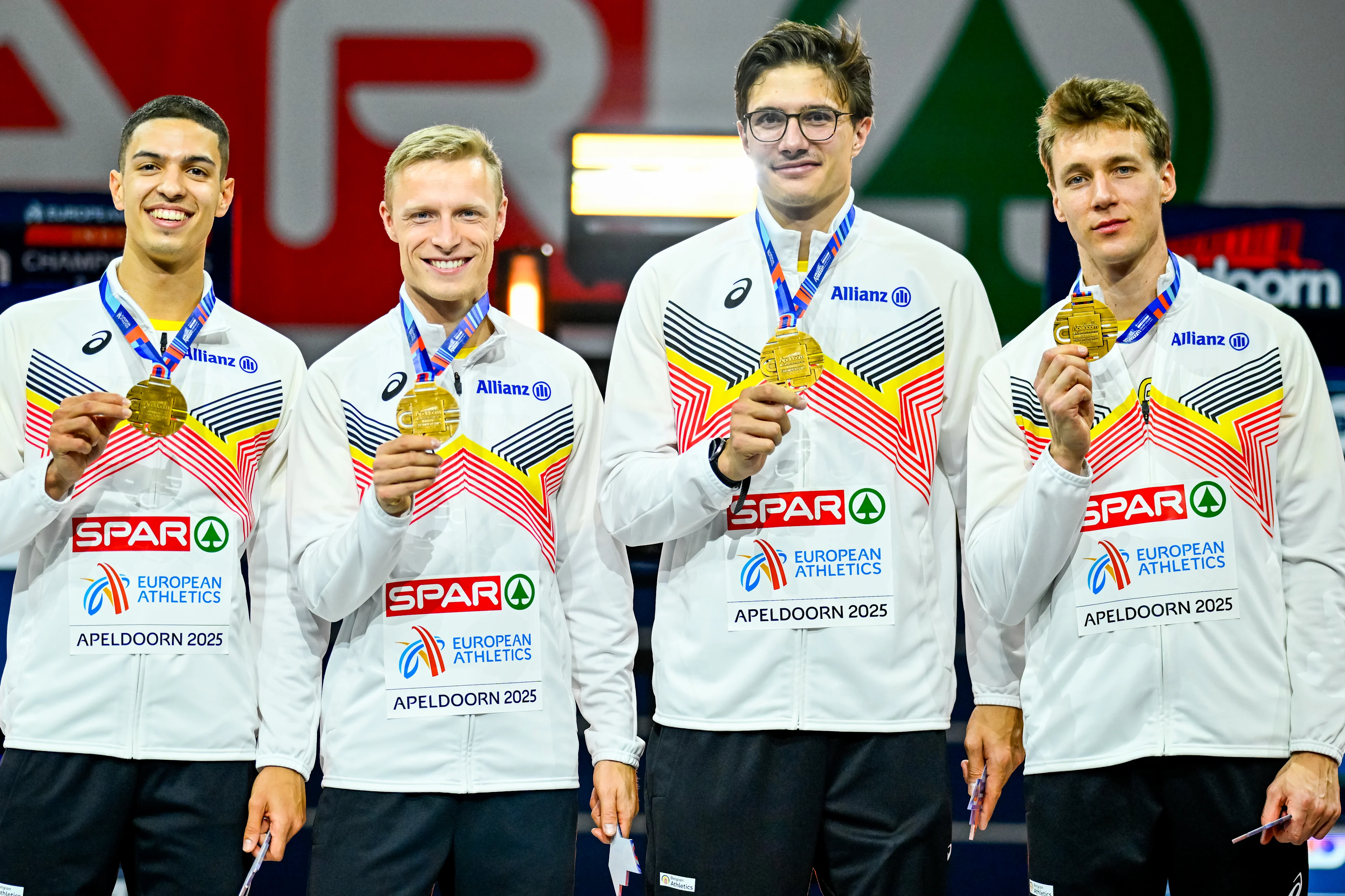 Belgian Jonathan Sacoor, Belgian Florent Mabille, Belgian Christian Iguacel and Belgian Julien Watrin celebrate on the podium after the European Athletics Indoor Championships, in Apeldoorn, The Netherlands, Sunday 09 March 2025. The championships take place from 6 to 9 March. BELGA PHOTO ERIC LALMAND