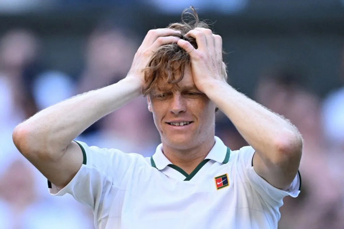 Italy's Jannik Sinner reacts to beating Germany's Alexander Zverev during their men's singles final tennis match on the fourteenth day of the 2026 Wimbledon Championships at The All England Lawn Tennis and Croquet Club in Wimbledon, southwest London, on July 12, 2026. Kirill KUDRYAVTSEV / AFP
