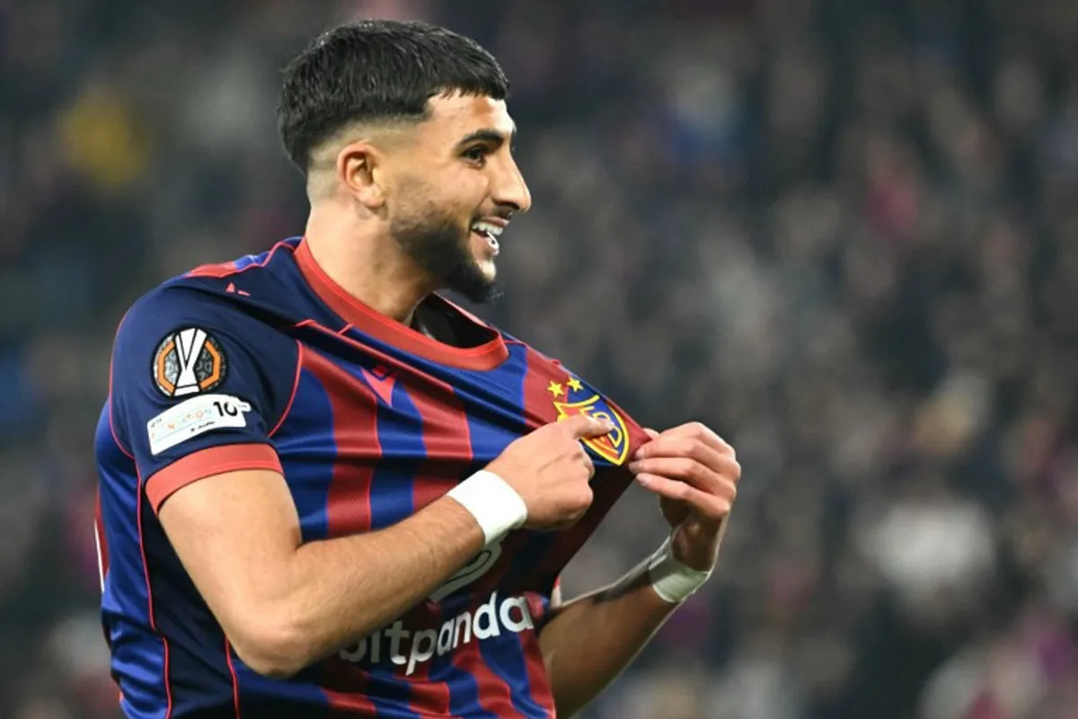 Basel's Moroccan forward #21 Ibrahim Salah celebrates after scoring his team third goal during the UEFA Europa League, league phase day 4, football match between FC Basel and FCS Bucarest at the St. Jakob-Park Stadium, in Basel, on November 6, 2025.  SEBASTIEN BOZON / AFP