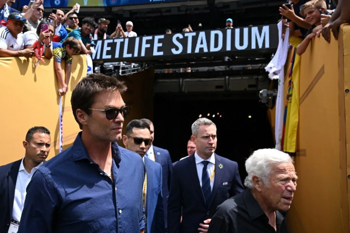 Former NFL player Tom Brady (L) and CEO of New England Patriots Robert Kraft arrive ahead the FIFA Club World Cup 2025 final football match between England's Chelsea and France's Paris Saint-Germain at the MetLife Stadium in East Rutherford, New Jersey on July 13, 2025. ANGELA WEISS / AFP