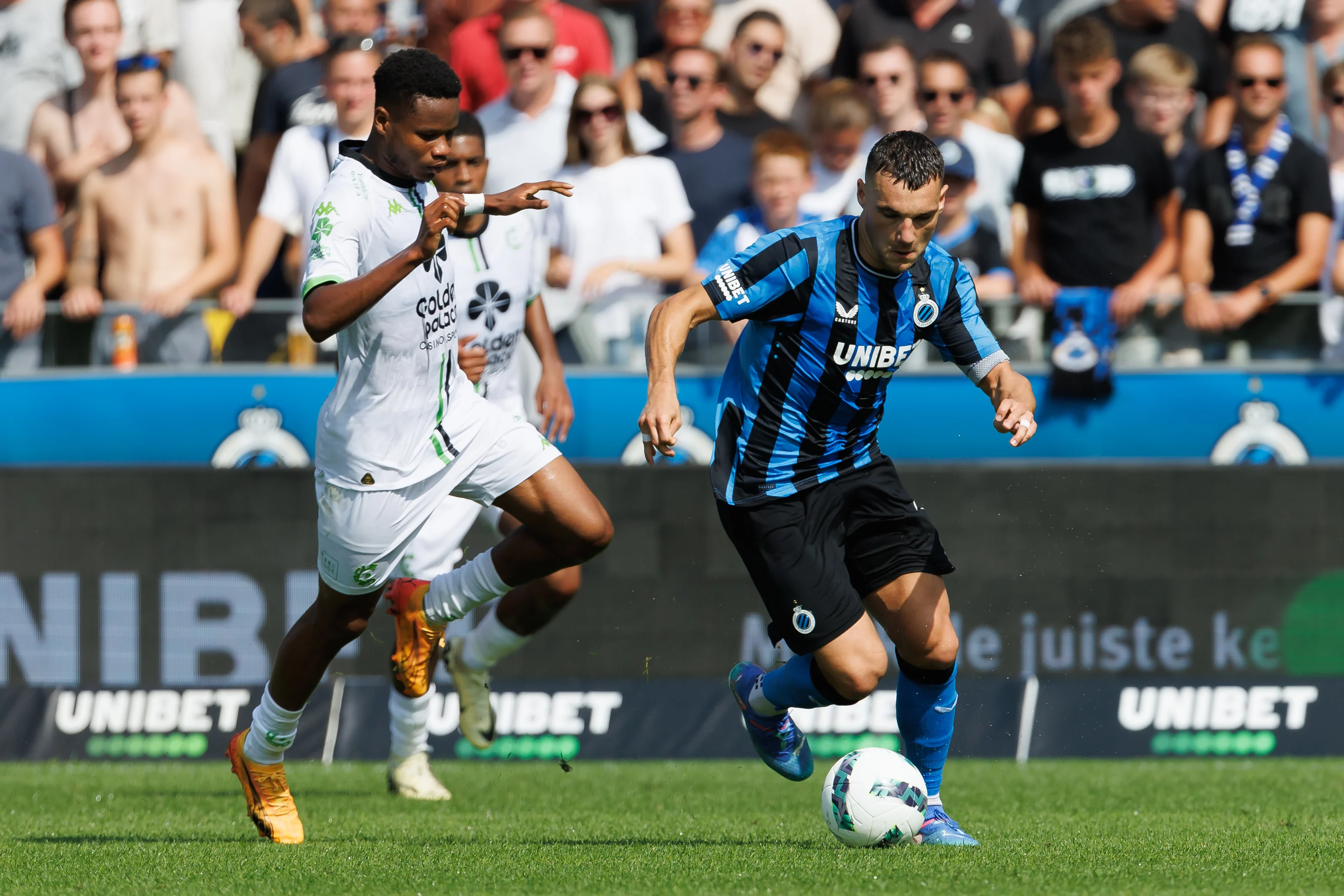 Cercle's Lawrence Agyekum and Club's Ferran Jutgla fight for the ball during a soccer match between Club Brugge KV and Cercle Brugge, Sunday 01 September 2024 in Brugge, on the sixth day of the 2024-2025 season of the 'Jupiler Pro League' first division of the Belgian championship. BELGA PHOTO KURT DESPLENTER