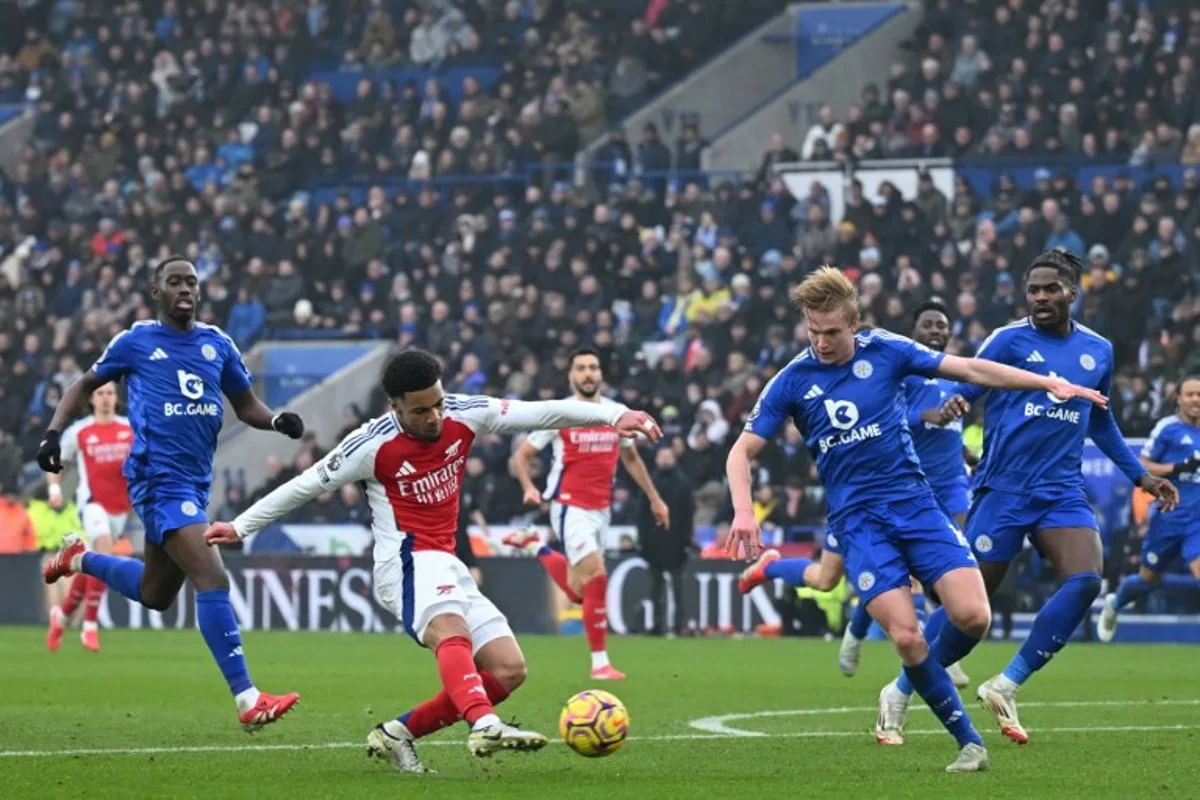 Arsenal's English midfielder #53 Ethan Nwaneri hits the post with this shot during the English Premier League football match between Leicester City and Arsenal at King Power Stadium in Leicester, central England on February 15, 2025.  JUSTIN TALLIS / AFP