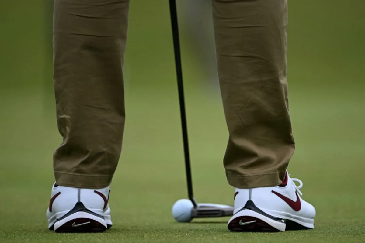 Northern Ireland's Rory McIlroy putts on the 12th green during a practice round ahead of the 152nd British Open Golf Championship at Royal Troon on the south west coast of Scotland on July 17, 2024.  ANDY BUCHANAN / AFP