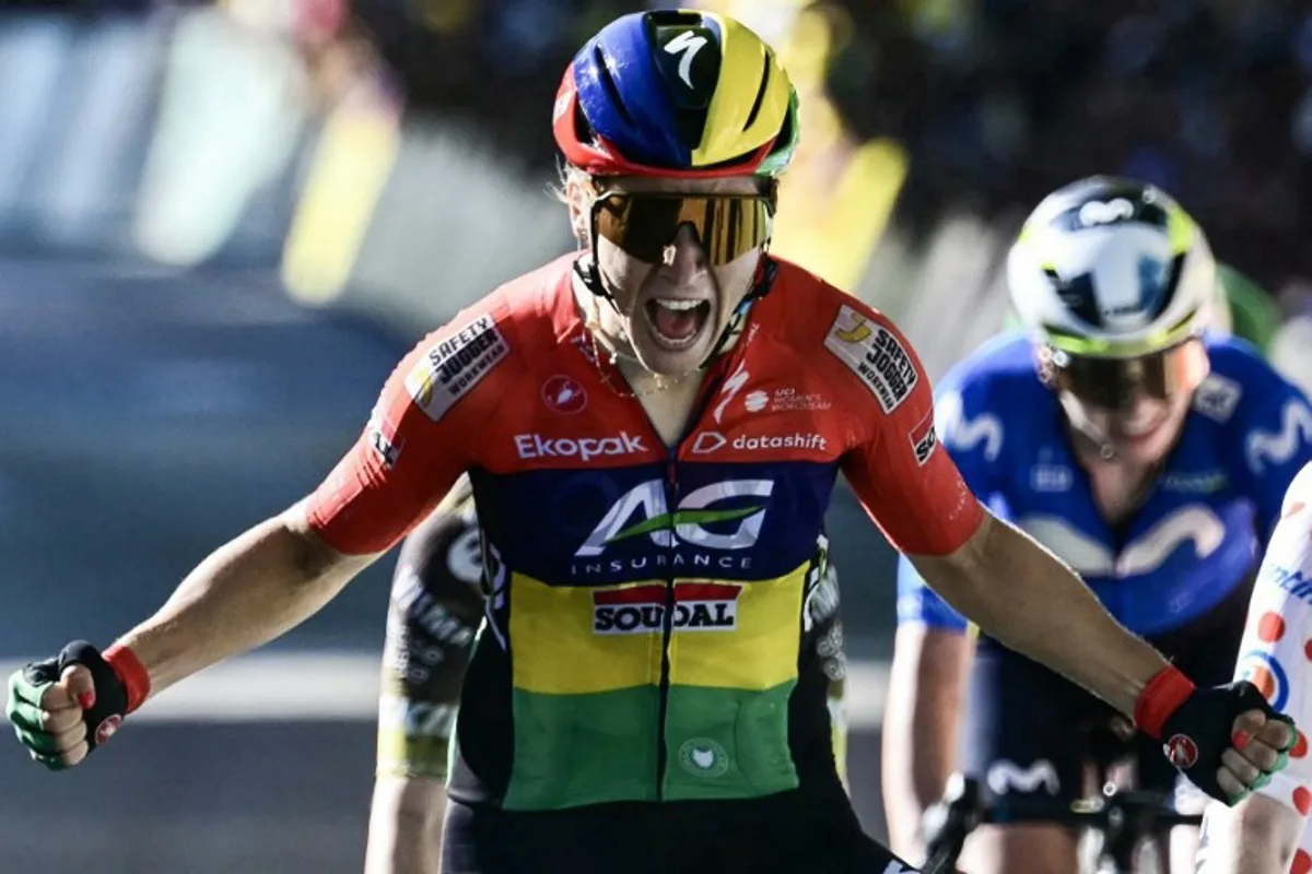 AG Insurance-Soudal Team's Mauritian rider Kim Le Court-Pienaar celebrates as she crosses the finish line to win the 6th (out of 9) stage of the fifth edition of the Women's Tour de France cycling race, 153.4 km from Montbrison to Tournon-sur-Rhone, in Tournon-sur-Rhone, central-eastern France on August 6, 2026. NICOLAS TUCAT / AFP