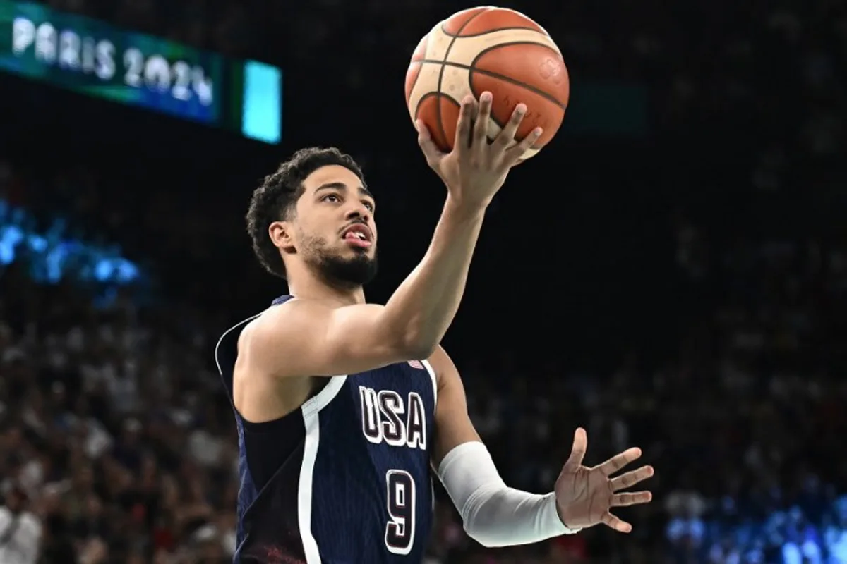 USA's #09 Tyrese Haliburton goes to the basket in the men's quarterfinal basketball match between Brazil and the USA during the Paris 2024 Olympic Games at the Bercy  Arena in Paris on August 6, 2024.  Aris MESSINIS / AFP