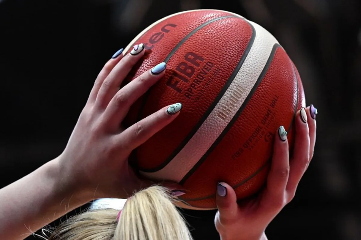 China's Li Meng takes a free throw during the women's Asia Cup 2023 basketball game against New Zealand in Sydney on June 27, 2023.   Saeed KHAN / AFP