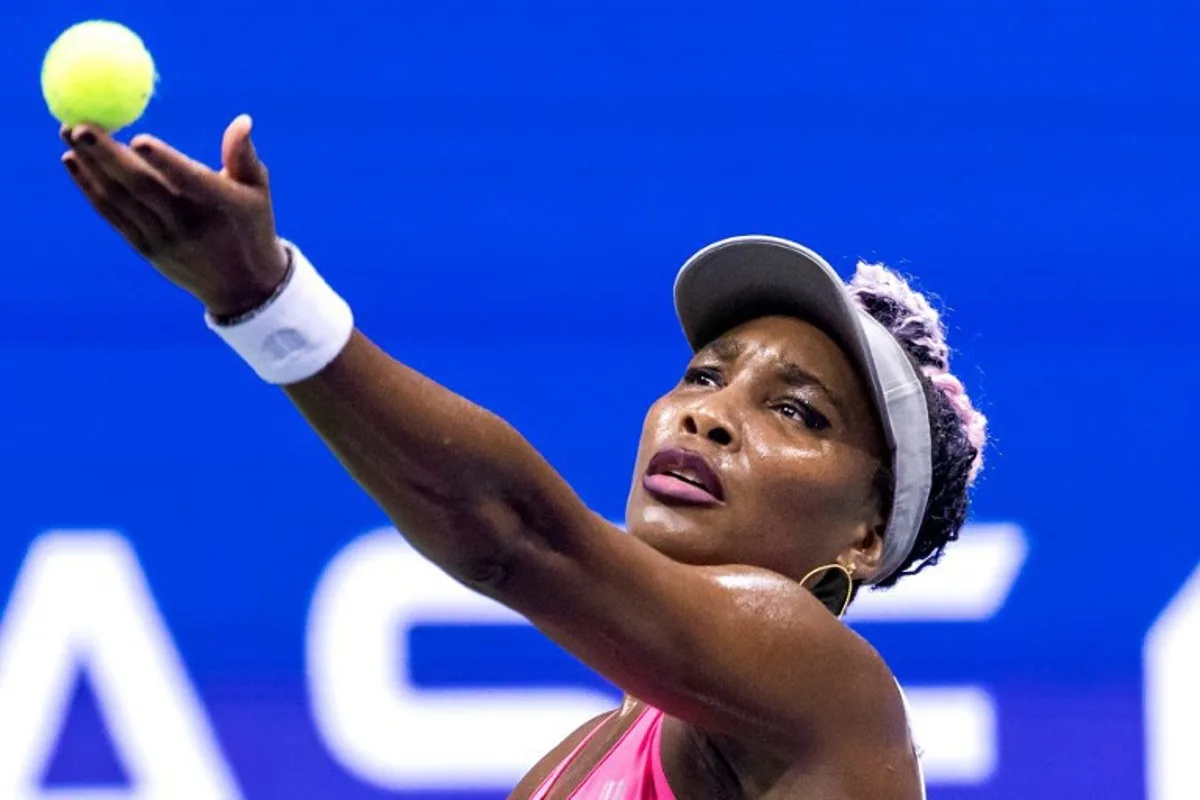 USA's Venus Williams serves to Belgium's Greet Minnen during the US Open tennis tournament women's singles first round match at the USTA Billie Jean King National Tennis Center in New York City, on August 29, 2023.  COREY SIPKIN / AFP