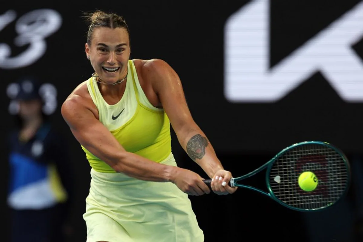 Belarus' Aryna Sabalenka hits a shot against USA's Sloane Stephens during their women's singles match on day one of the Australian Open tennis tournament in Melbourne on January 12, 2025.  Adrian Dennis / AFP