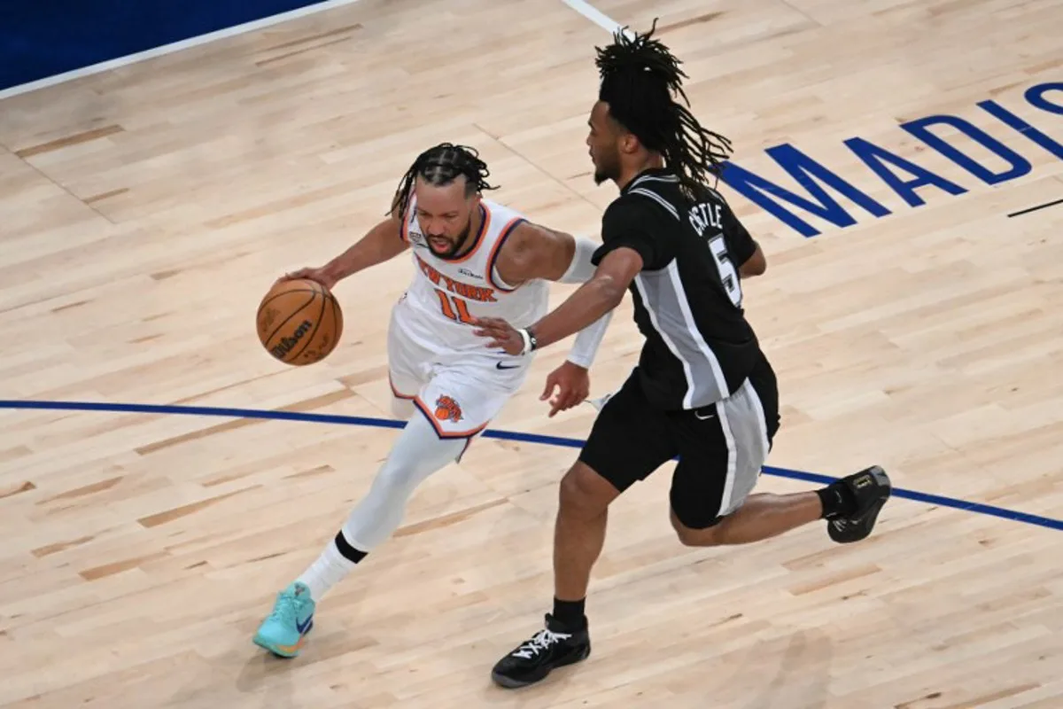Knicks guard #11 Jalen Brunson and San Antonio Spurs' #05 Stephon Castle vie for the ball during Game Three of the NBA Finals between the San Antonio Spurs and the New York Knicks at Madison Square Garden in New York on June 8, 2026.  SAUL LOEB / AFP