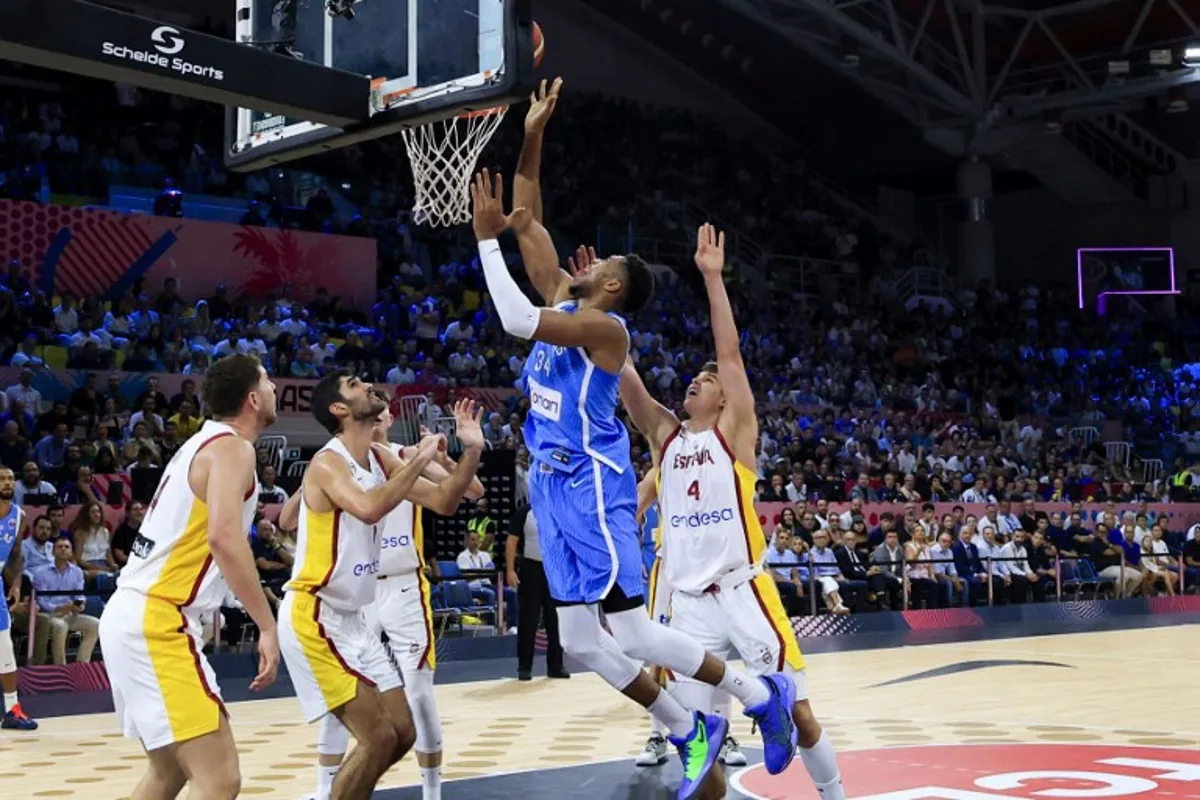 Greece's small forward #34 Giannis Antetokounmpo drives to the basket during the FIBA EuroBasket 2025 basketball match between Spain and Greece at Spyros Kyprianou Arena in Limassol on September 4, 2025. ALEX MITA / AFP
