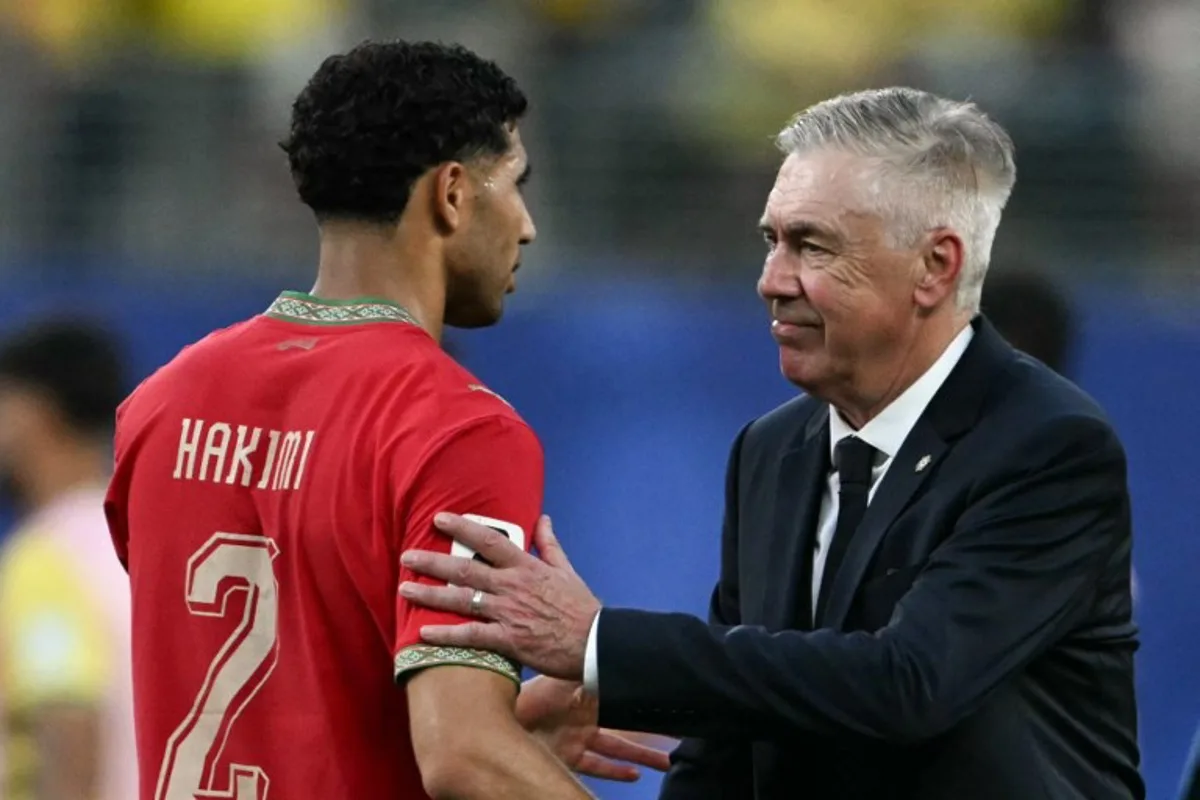 Brazil's Italian head coach Carlo Ancelotti greets Morocco's defender #02 Achraf Hakimi at the end of the 2026 World Cup Group C football match between Brazil and Morocco at the New York/New Jersey Stadium in East Rutherford on June 13, 2026. Mauro PIMENTEL / AFP