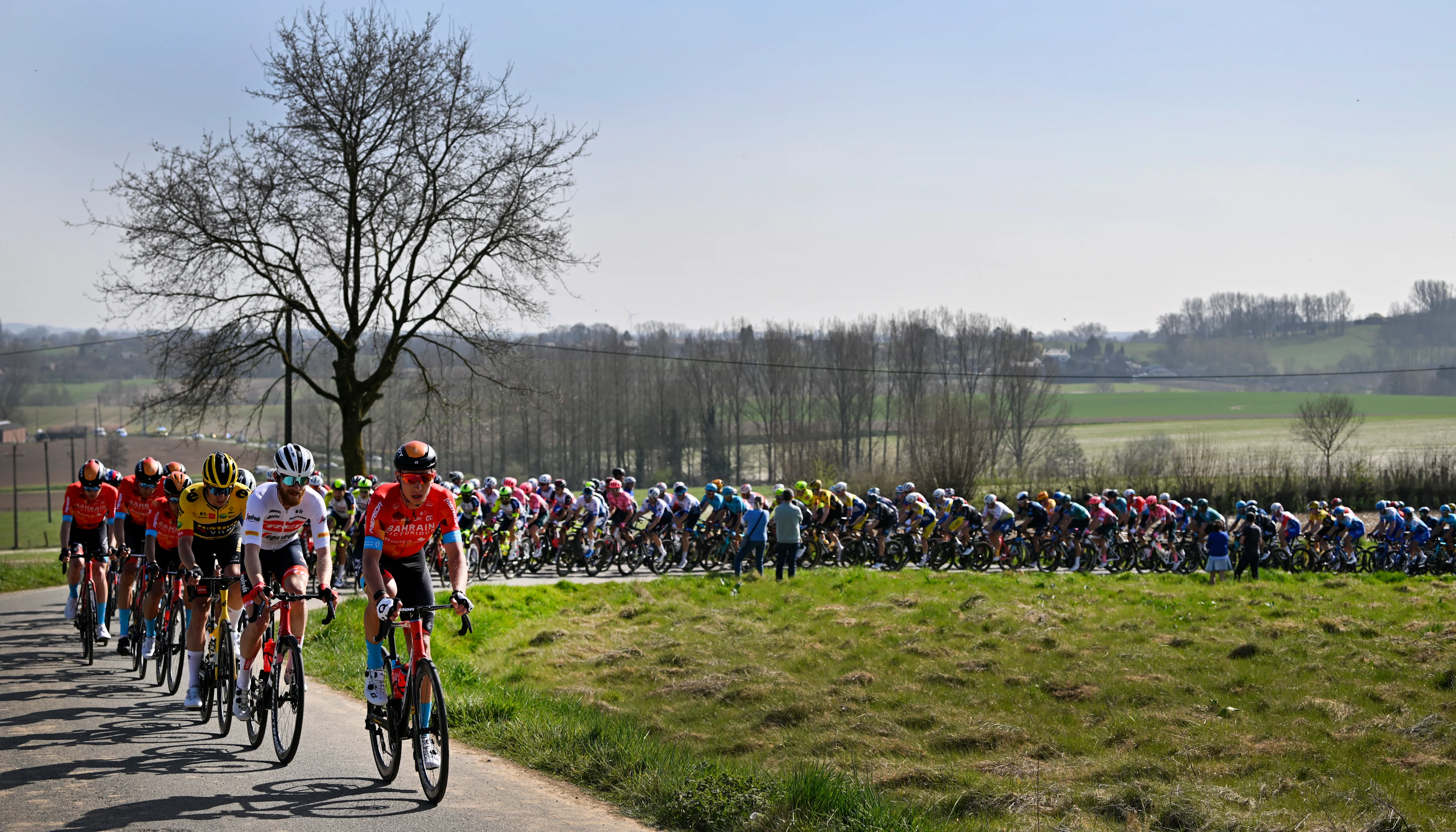 Illustration picture shows the pack of riders in action during the 'E3 Saxo Bank Classic' cycling race, 203,9km from and to Harelbeke, Friday 25 March 2022. BELGA PHOTO ERIC LALMAND