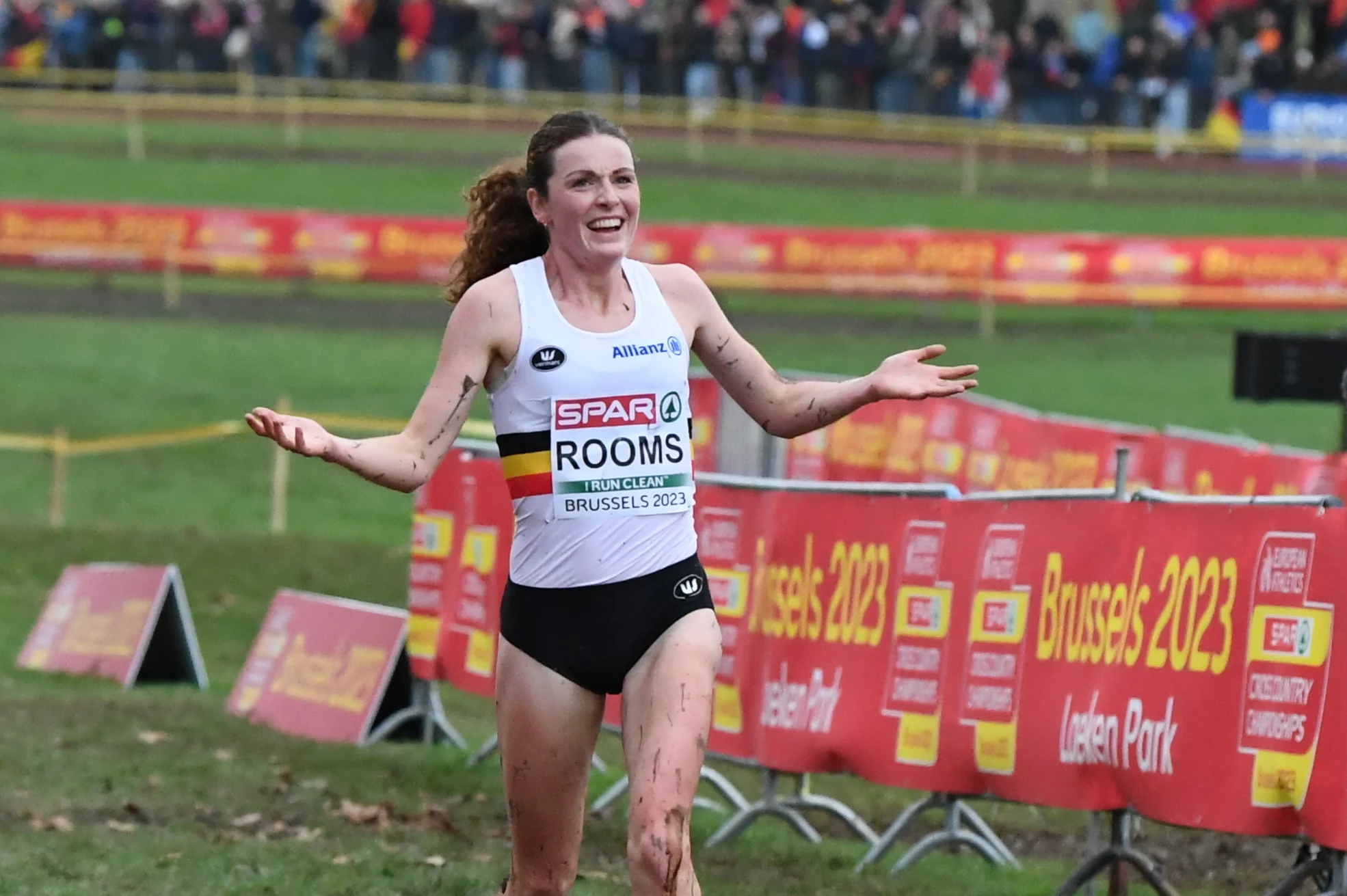 Belgian Lisa Rooms celebrates as she crosses the finish line at the elite women race at the European Cross Country Championships in Brussels, Sunday 10 December 2023 BELGA PHOTO JILL DELSAUX