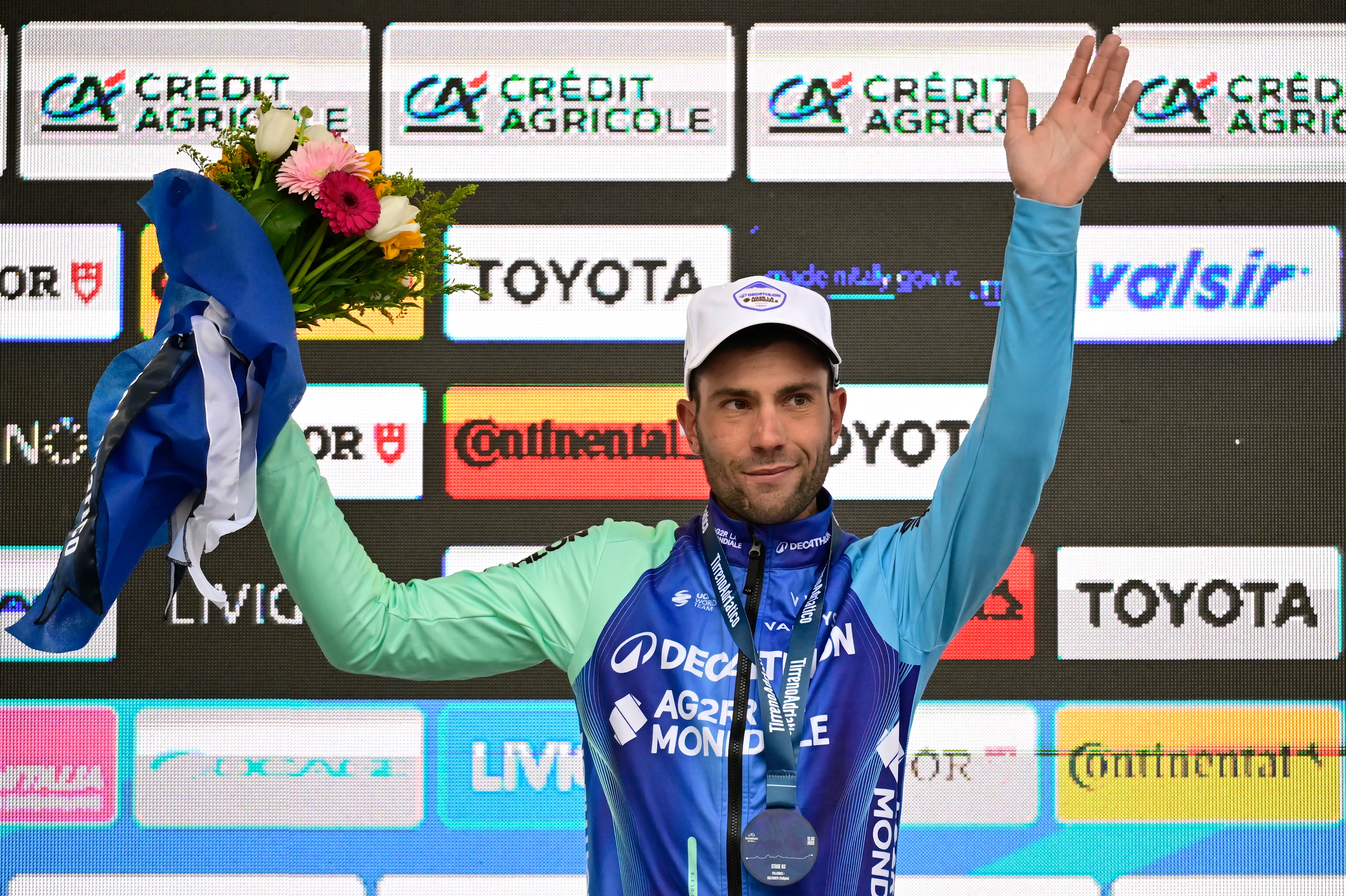 Italian Andrea Vendrame of Decathlon AG2R La Mondiale Team celebrates on the podium after winning the third stage of the Tirreno-Adriatico cycling race, a 239km race from Follonica to Colfiorito (Foligno), Italy, Wednesday 12 March 2025. BELGA PHOTO DIRK WAEM