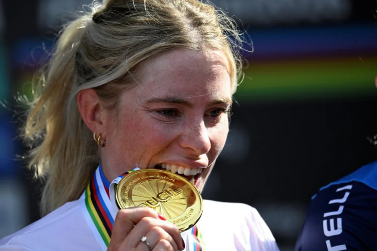 First-placed Demi Vollering of the Netherlands poses on the podium after the Women's Elite Road Race at the 2026 Union Cycliste Internationale (UCI) Road World Championships in Montreal, Quebec, on September 26, 2026.  Andrej Ivanov / AFP
