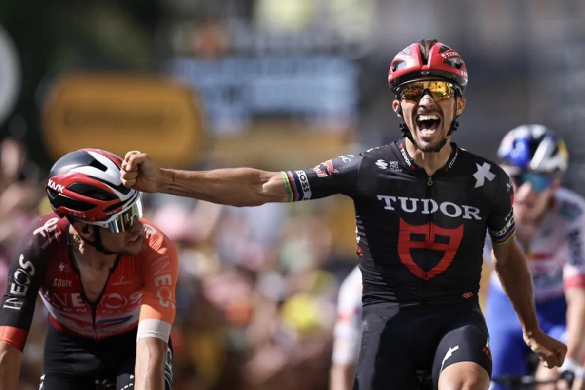 Tudor Pro Cycling Team's French rider Julian Alaphilippe cycles to the finish line to place third in the 15th stage of the 112th edition of the Tour de France cycling race, 169.3 km between Muret and Carcassonne, southwestern France, on July 20, 2025. Anne-Christine POUJOULAT / AFP
