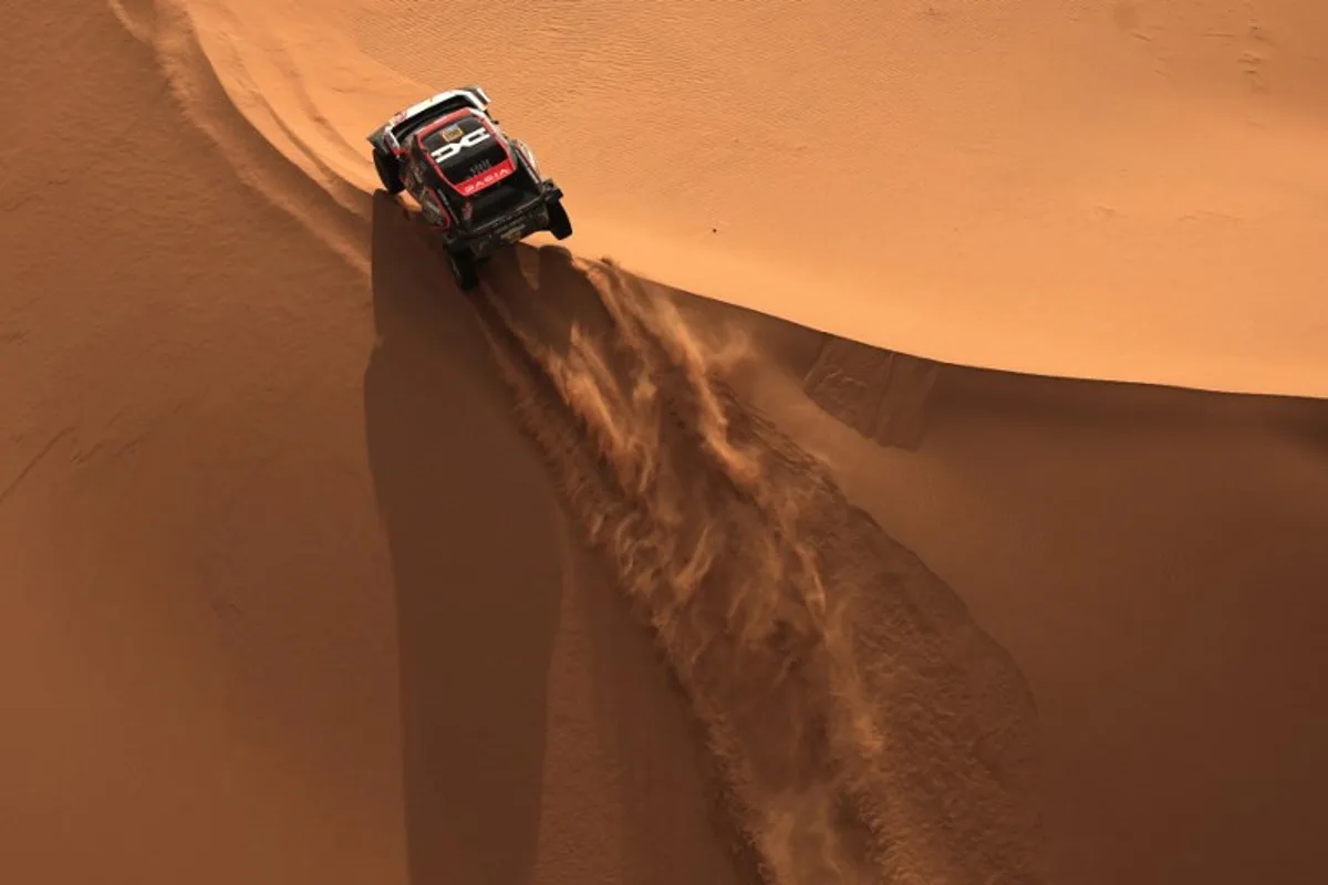 Qatari driver Nasser Al Attiyah and French co-driver Edouard Boulanger compete during Stage 7 of the Dakar Rally 2025, between Al Duwadimi and Al Duwadimi, Saudi Arabia, on January 11, 2025.  Valery HACHE / AFP