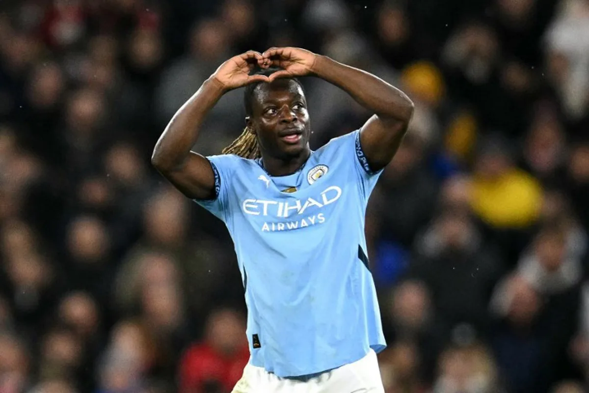 Manchester City's Belgian midfielder #11 Jeremy Doku celebrates scoring the team's third goal during the English Premier League football match between Manchester City and Nottingham Forest at the Etihad Stadium in Manchester, north west England, on December 4, 2024.  Oli SCARFF / AFP