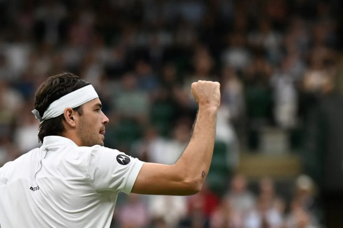 US player Taylor Fritz reacts as he plays against Australia's Jordan Thompson during their men's singles fourth round tennis match on the seventh day of the 2025 Wimbledon Championships at The All England Lawn Tennis and Croquet Club in Wimbledon, southwest London, on July 6, 2025. Glyn KIRK / AFP
