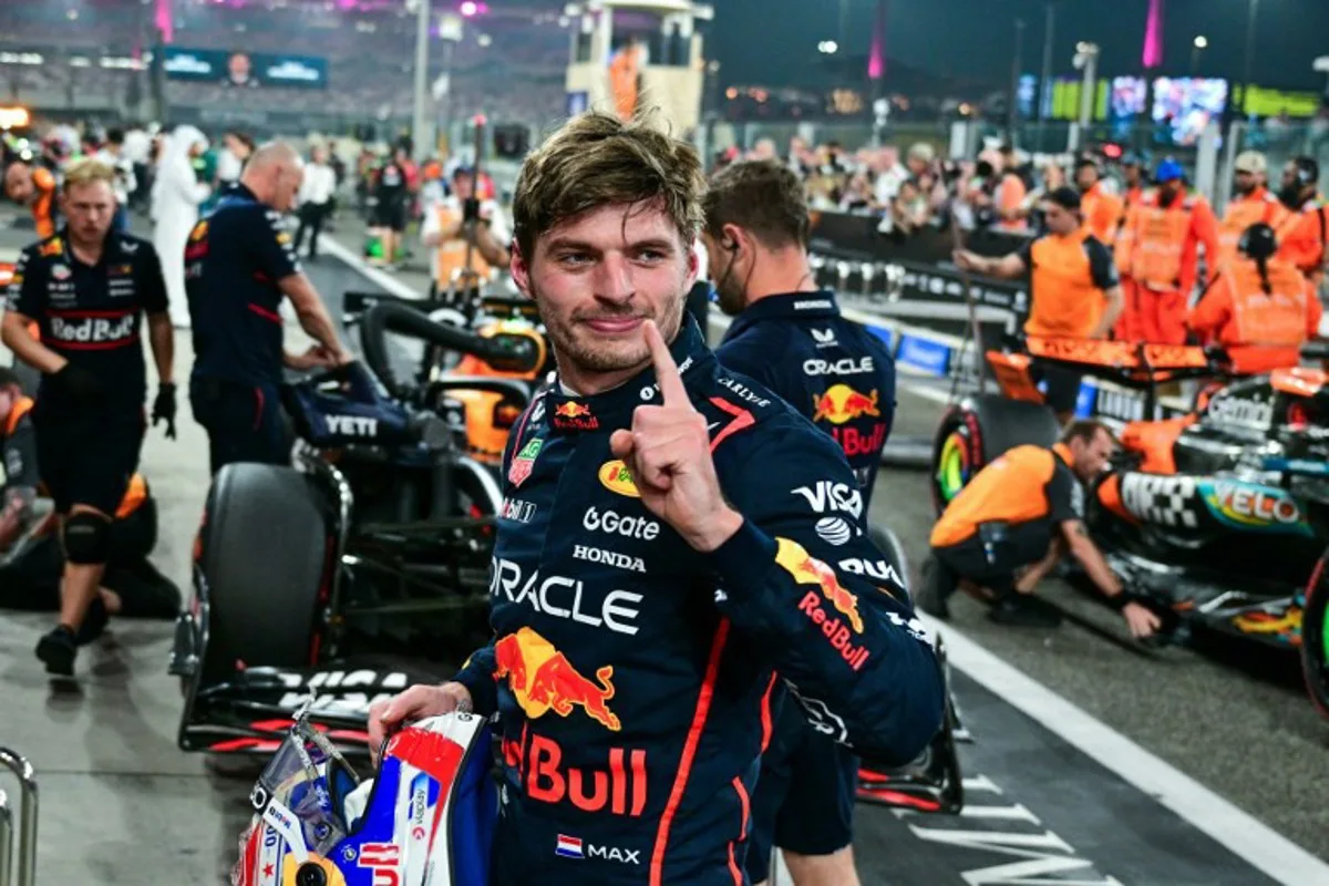 Red Bull Racing's Dutch driver Max Verstappen reacts after taking the pole position at the end of the qualifying session ahead of the Abu Dhabi Formula One Grand Prix at the Yas Marina Circuit in Abu Dhabi on December 6, 2025. Andrej ISAKOVIC / AFP