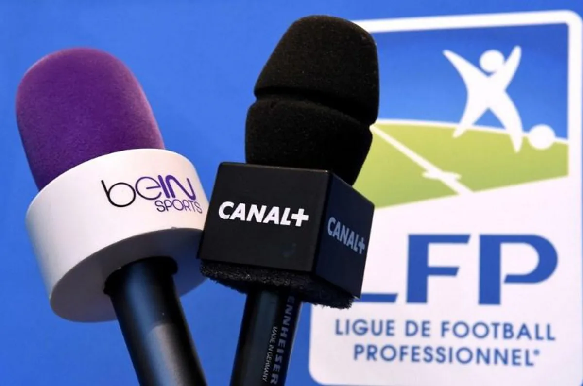 Photo taken on April 4, 2014 in Paris shows microphones of French television channel Canal + and Qatari station BeIn Sports. The French Ligue de Football Professionnel (LFP) awarded on April 4 the broadcasting rights for the French Ligue 1 and Ligue 2 football matches for the period 2016-2020 for a record 748.5 million EUR per year. The paying television channel, Canal +, will have the rights to the three best matches of each day. Canal +'s Qatari rival BeIn Sports won the remaining rights. AFP PHOTO / FRANCK FIFE Franck FIFE / AFP