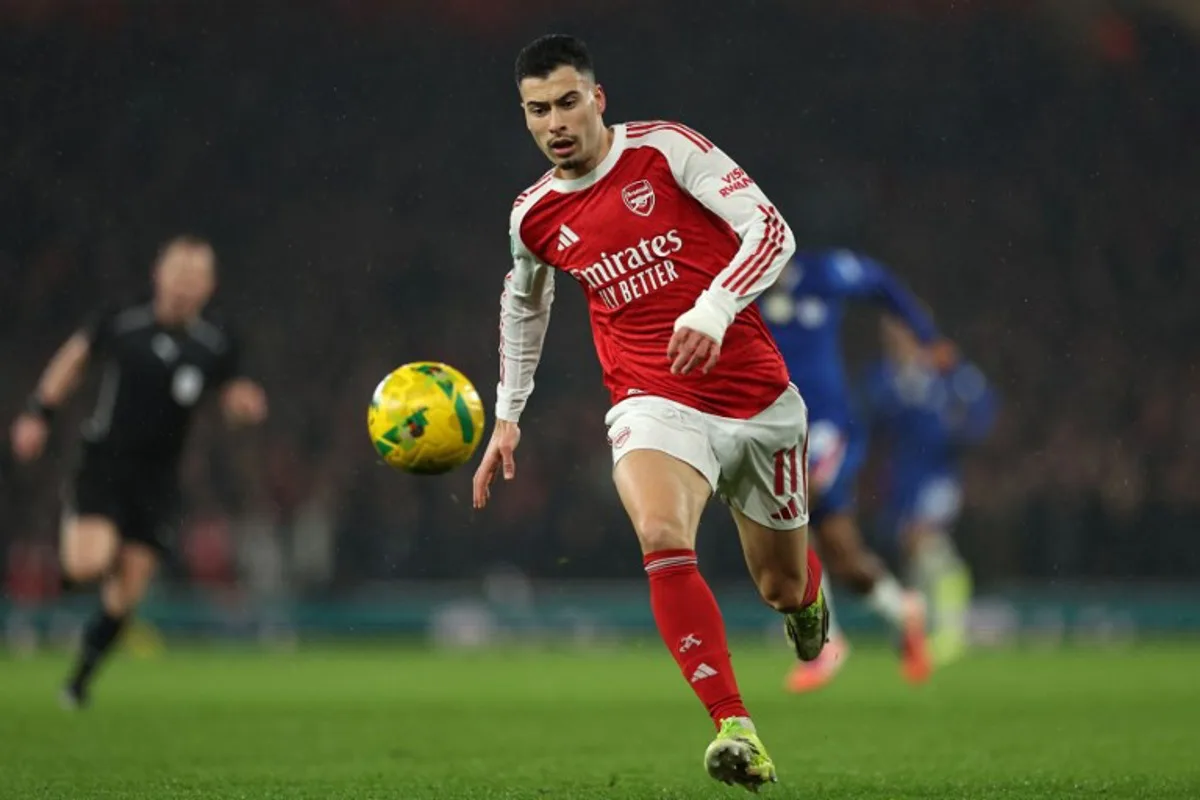 Arsenal's Brazilian midfielder #11 Gabriel Martinelli runs with the ball during the English League Cup semi final second leg, football match between Arsenal and Chelsea at the Emirates Stadium, in London on February 3, 2026.  Adrian Dennis / AFP