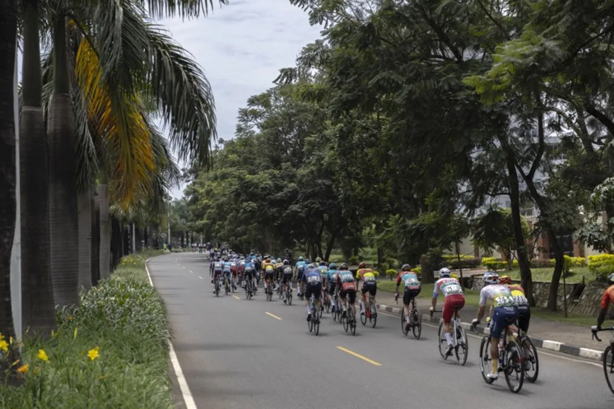 The pack rides during the last stage of the 16th Tour du Rwanda in Kigali on February 25, 2024.  Guillem Sartorio / AFP